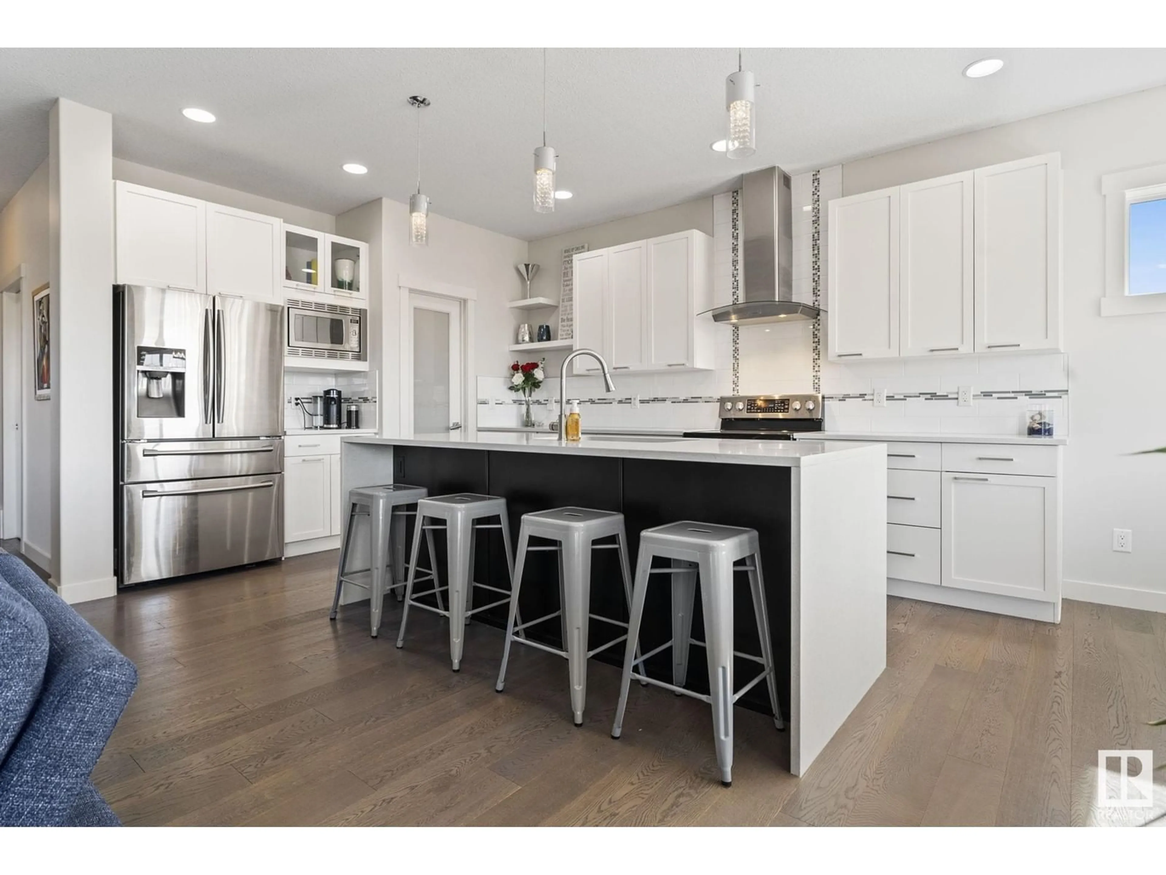 Open concept kitchen, wood/laminate floor for SW - 3726 PARKER CO, Edmonton Alberta T6W3A8