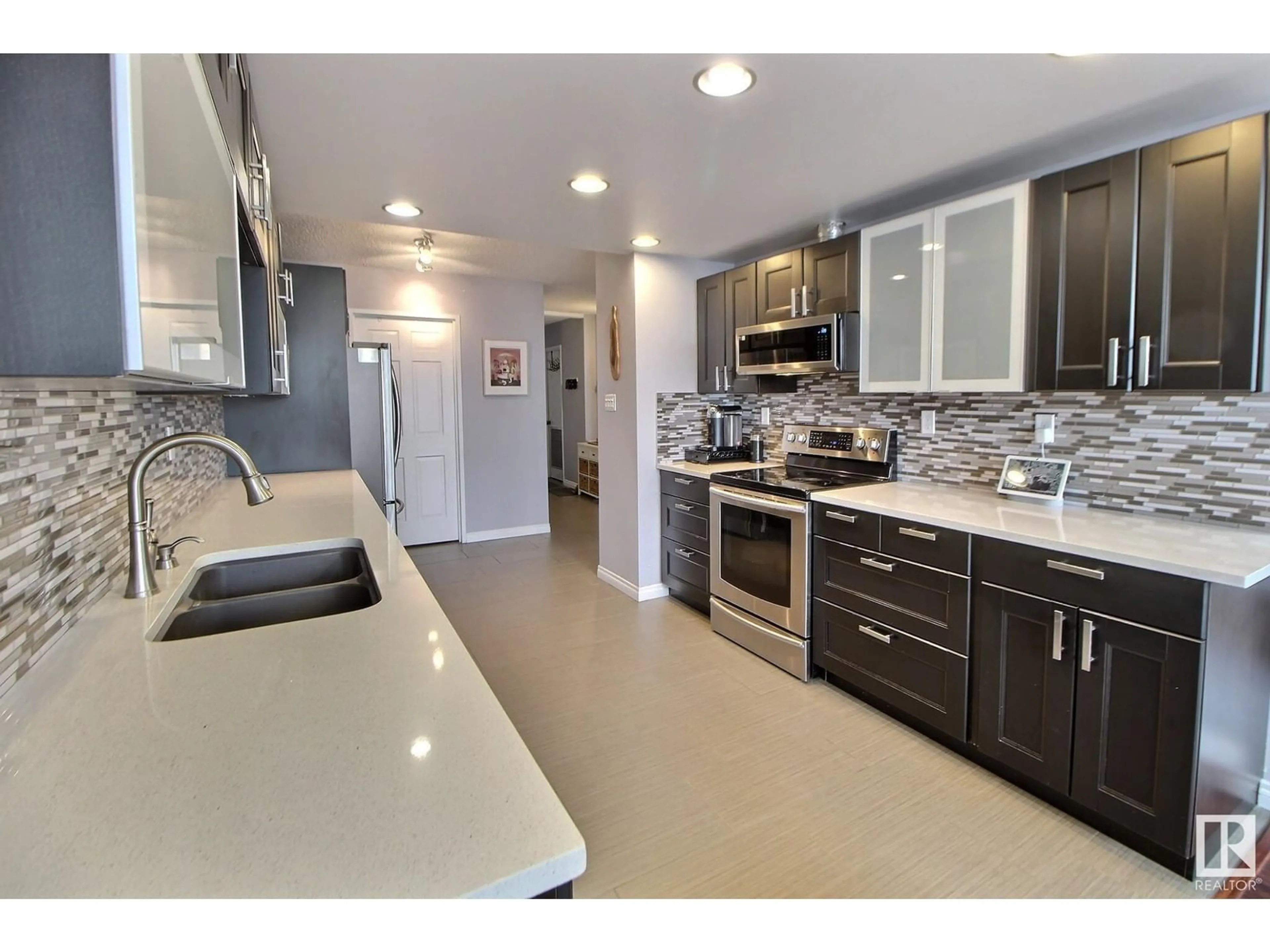 Open concept kitchen, ceramic/tile floor for #204 - 9921 104 ST, Edmonton Alberta T5K2K3