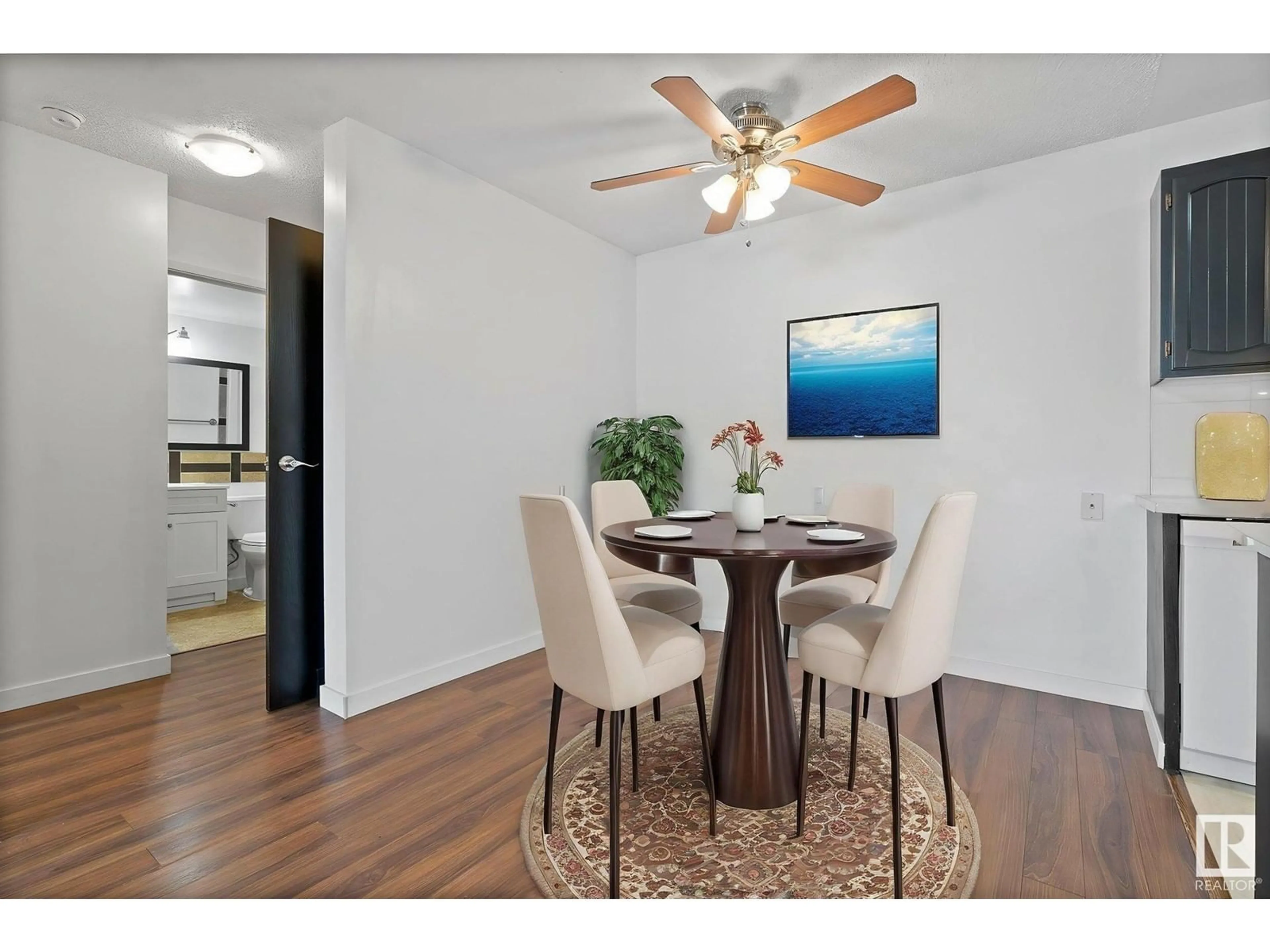 Dining room, wood/laminate floor for 111 - 3610 43 AVE, Edmonton Alberta T6L5T2