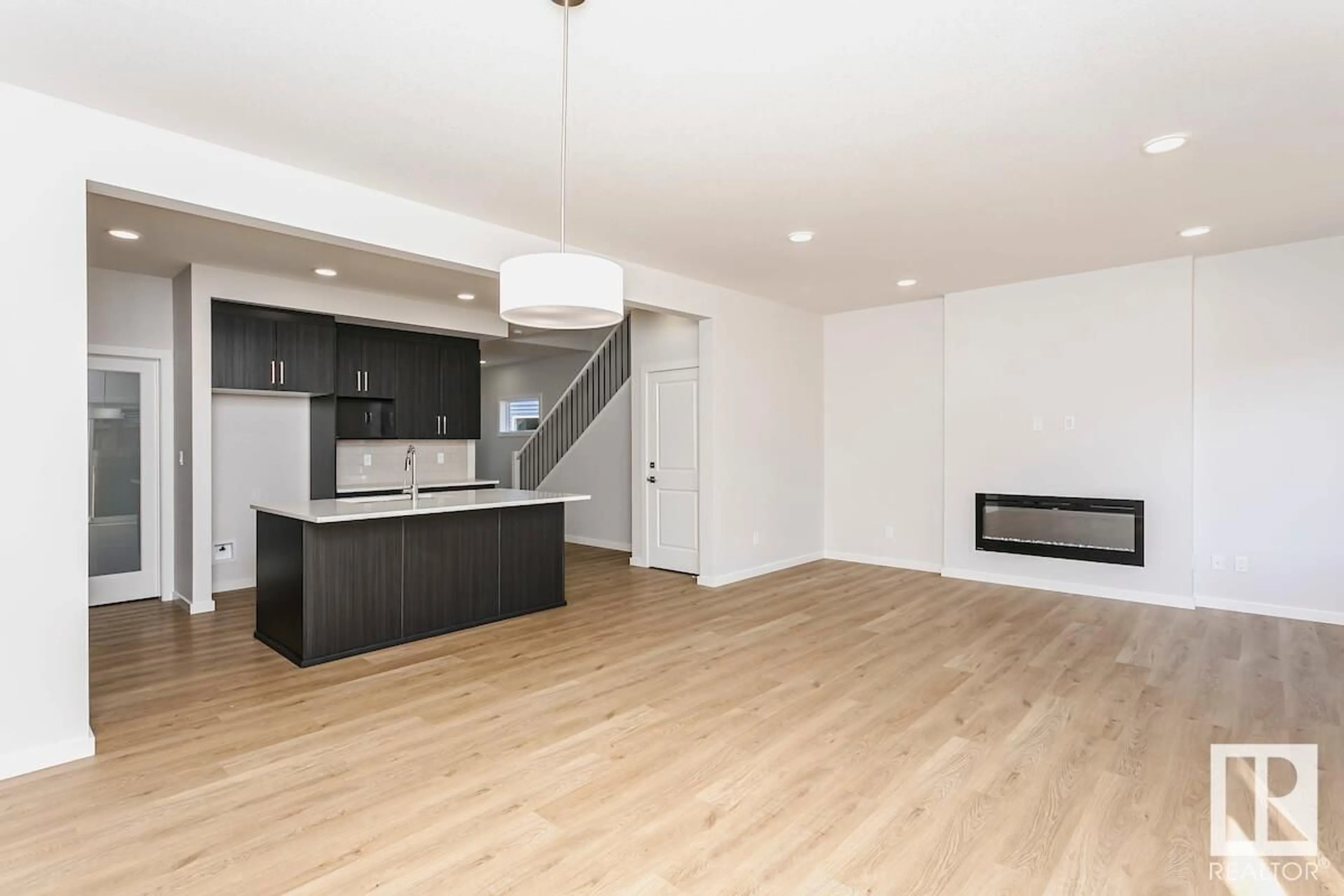 Open concept kitchen, wood/laminate floor for SW - 6410 28 AV, Edmonton Alberta T6X1A3