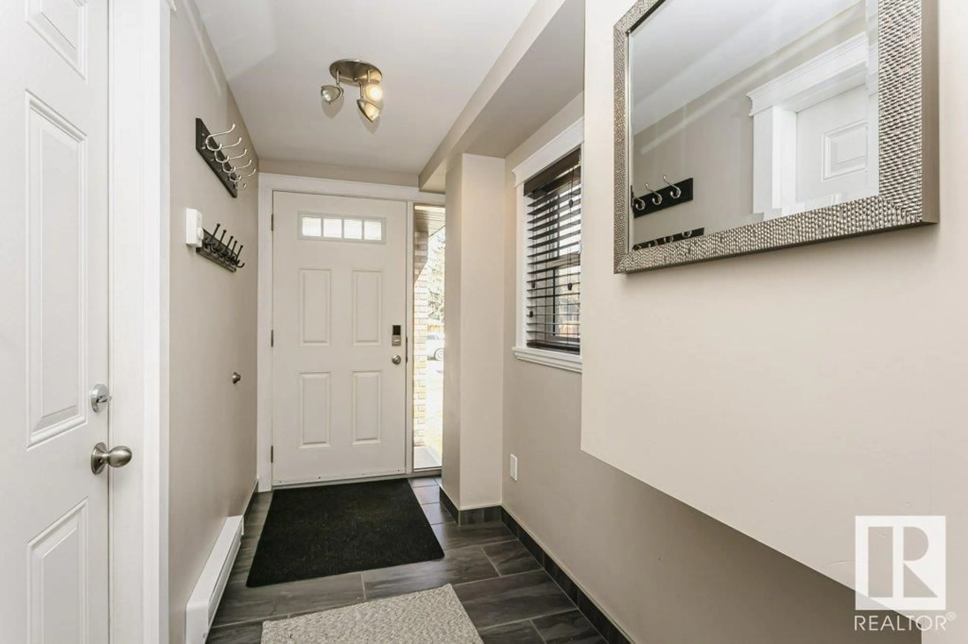 Indoor entryway for 3527 13 AV, Edmonton Alberta T6L2M1
