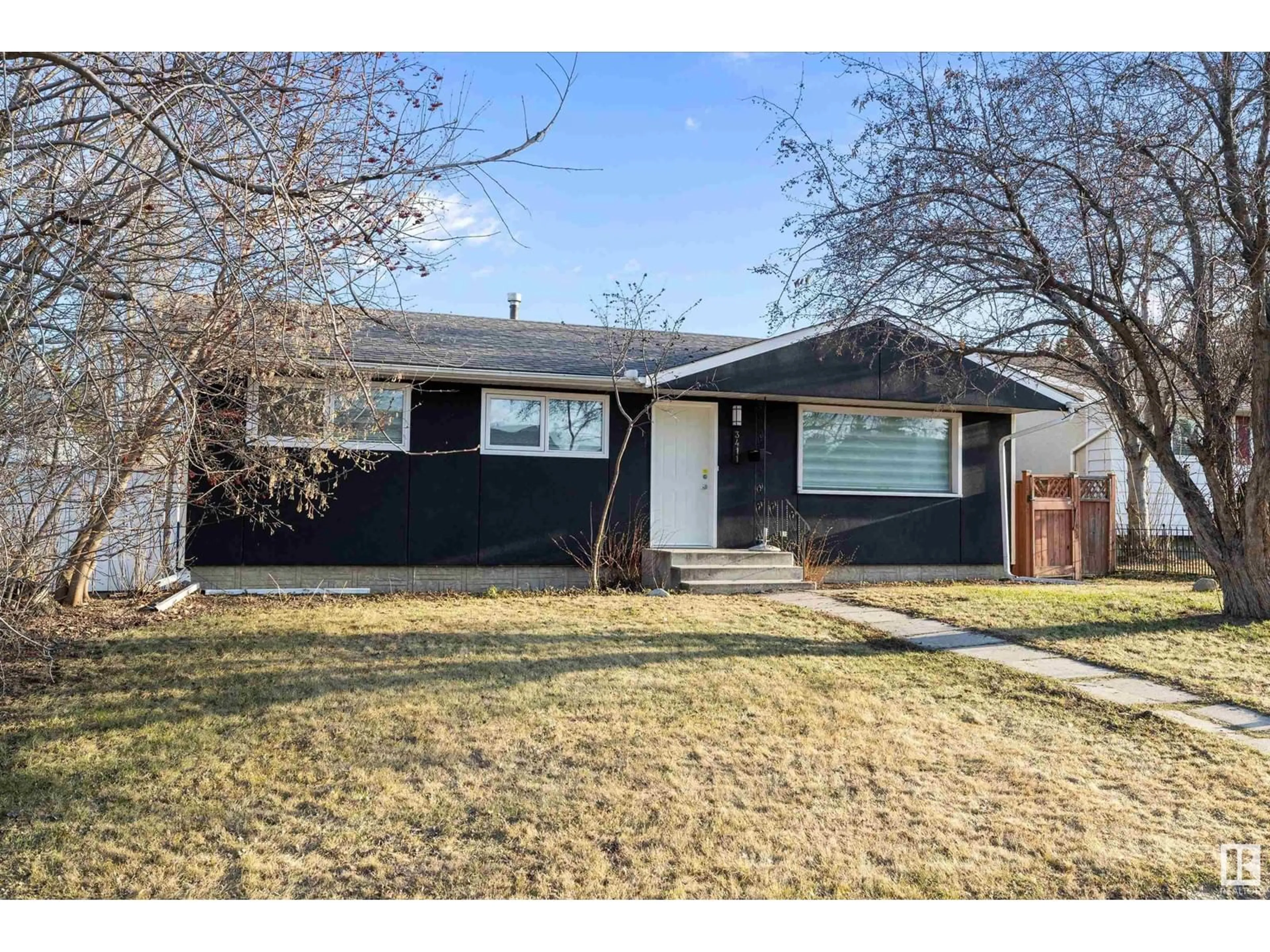 Home with vinyl exterior material, street for 3411 105 AV, Edmonton Alberta T5W0B6