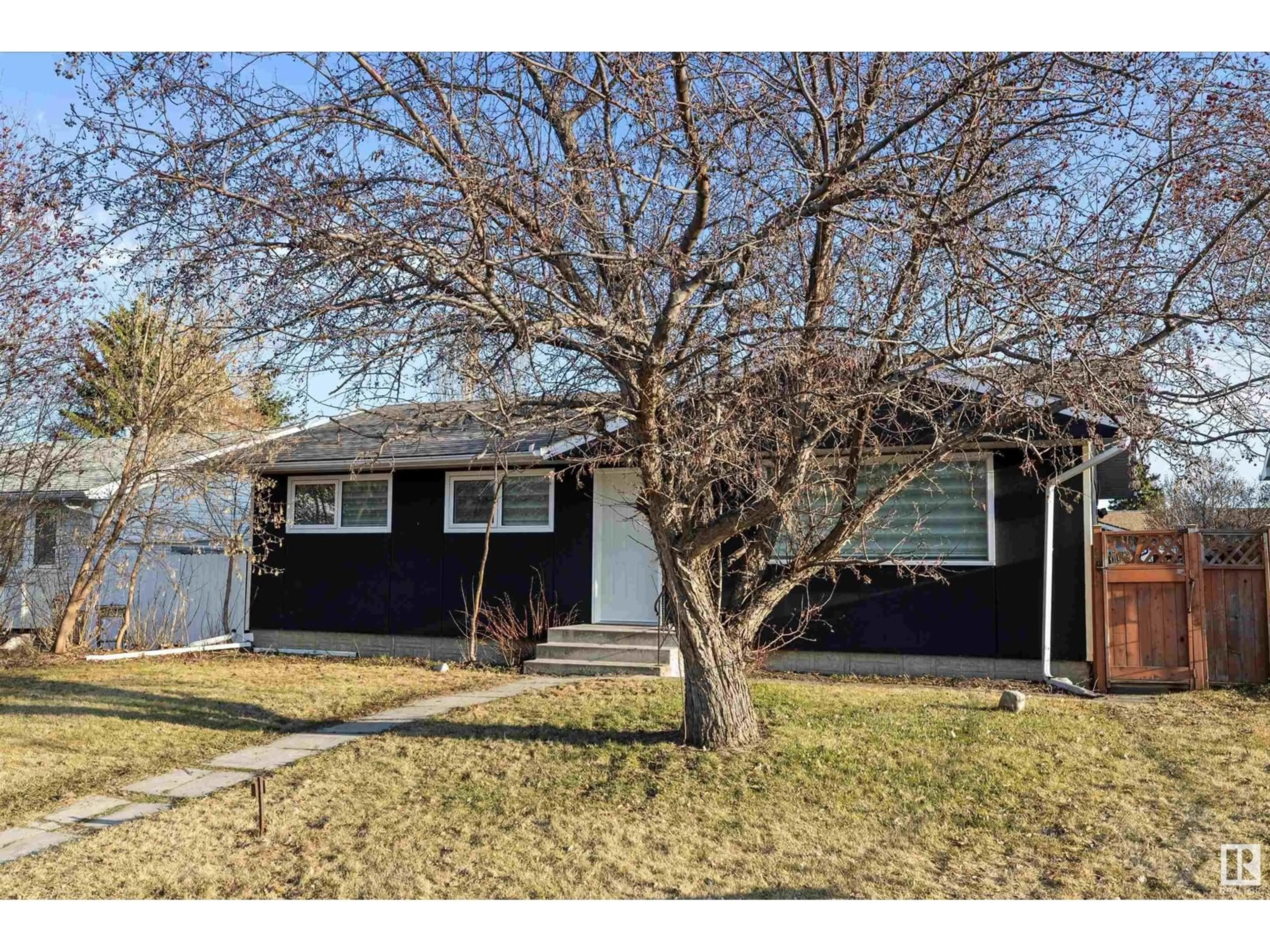 Home with vinyl exterior material, street for 3411 105 AV, Edmonton Alberta T5W0B6