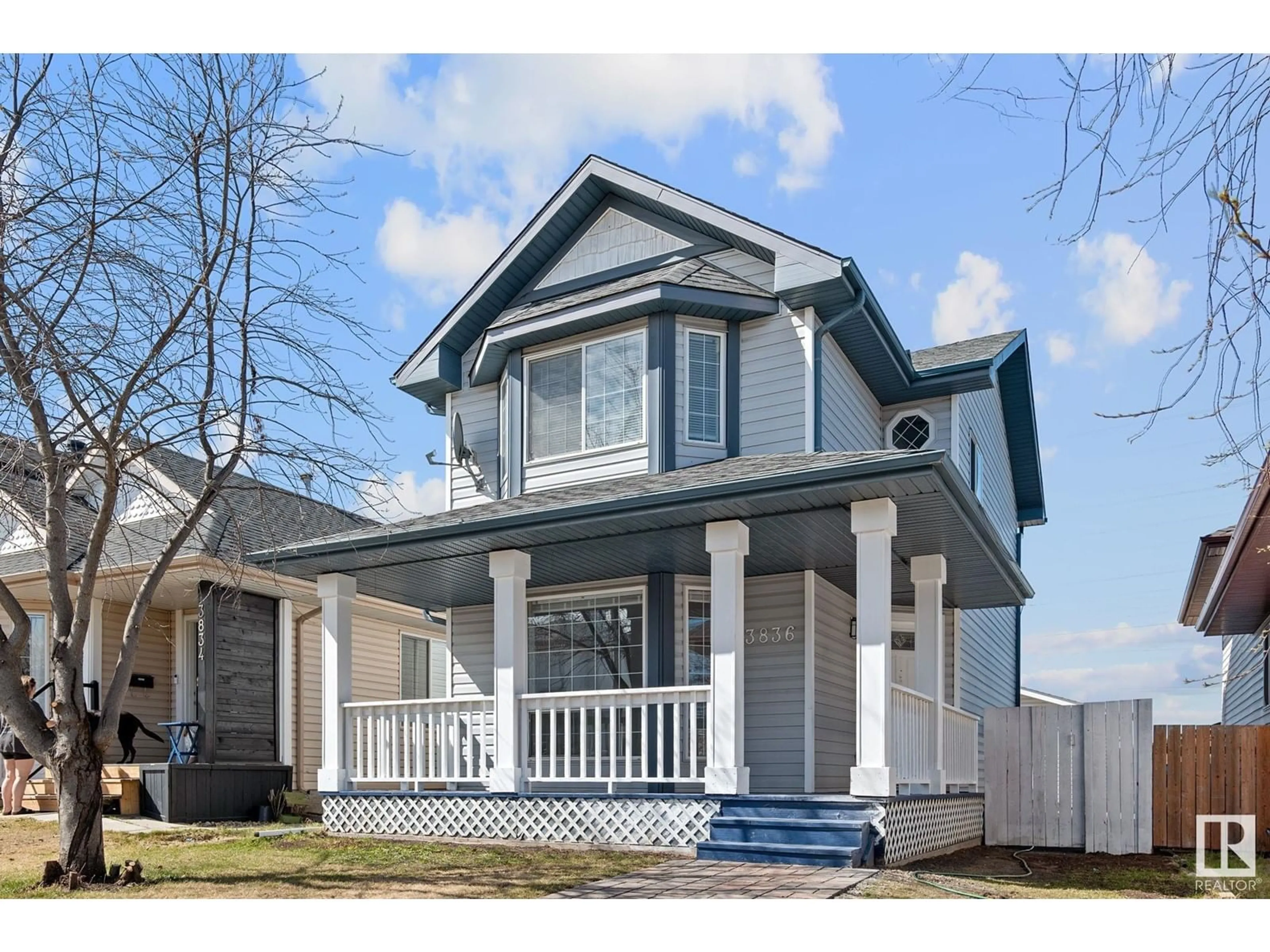 Home with vinyl exterior material, street for 3836 24 ST, Edmonton Alberta T6T1K6