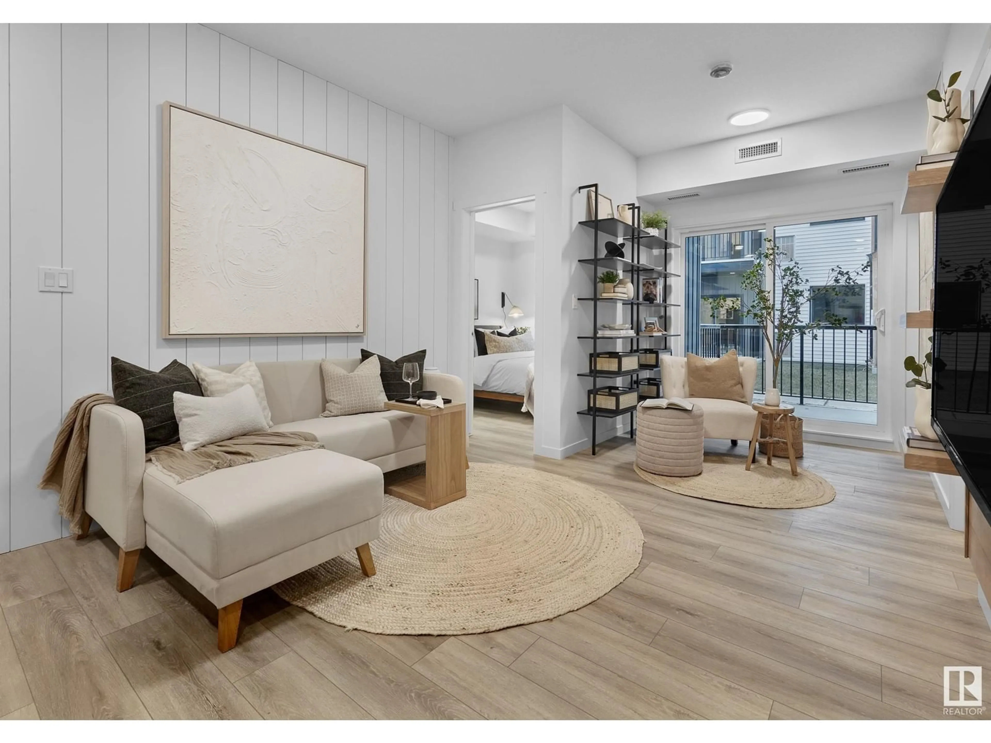 Living room with furniture, wood/laminate floor for #104 - 3715 141 ST, Edmonton Alberta T6W5M9