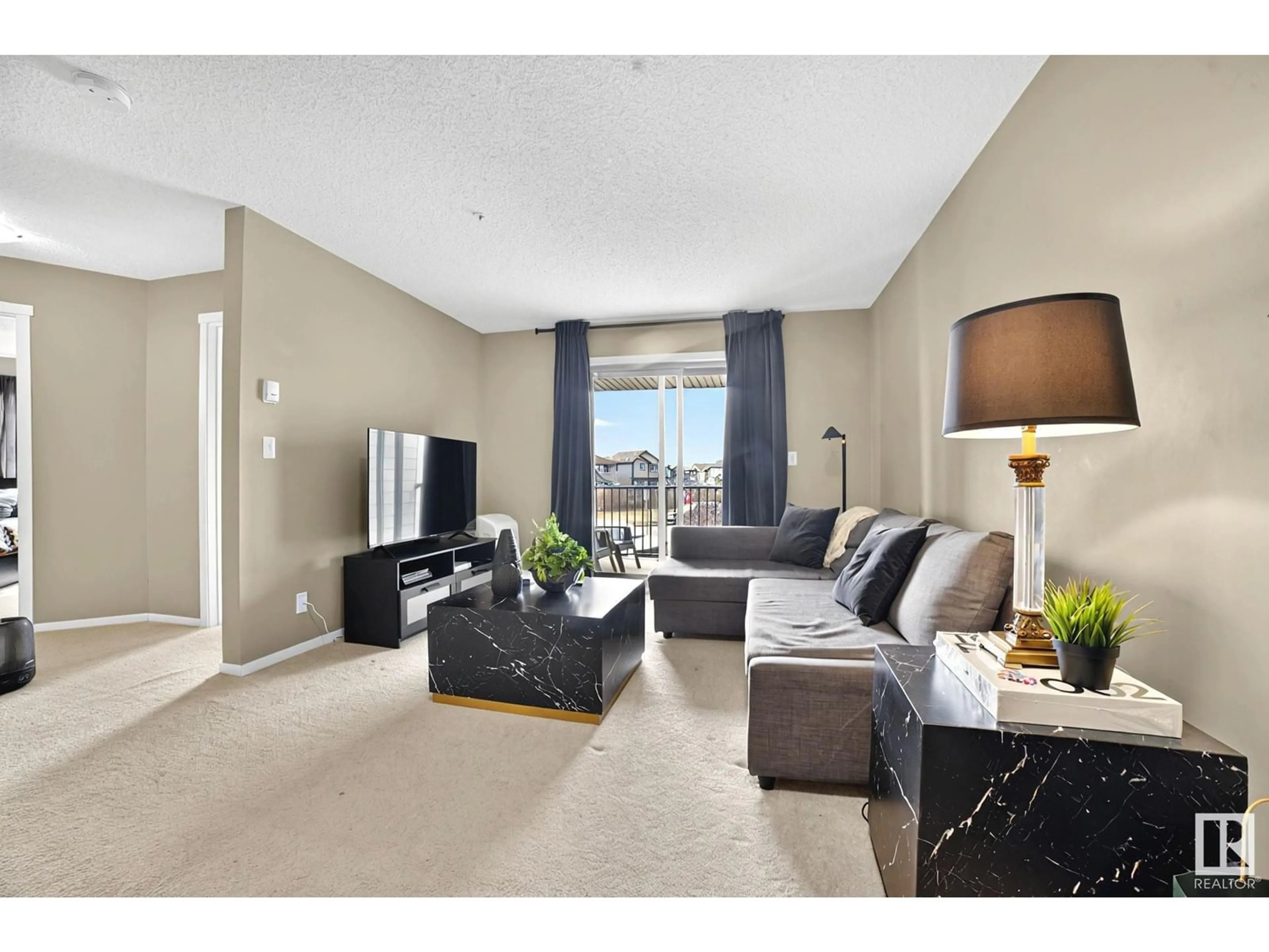Living room with furniture, carpet floor for 209 - 111 WATT CM, Edmonton Alberta T6X2C6