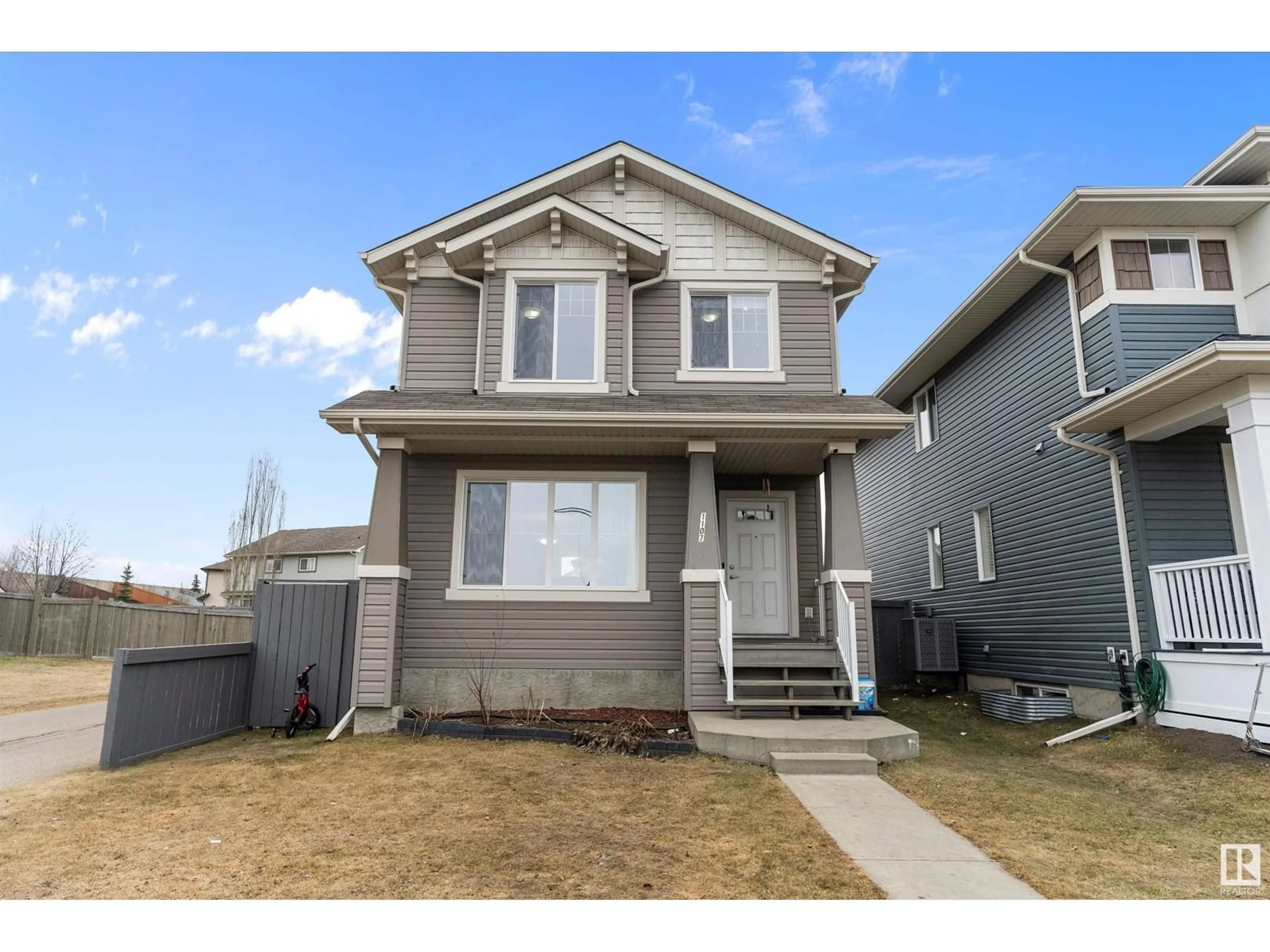 Home with vinyl exterior material, street for 1107 36 AV, Edmonton Alberta T6T0E9