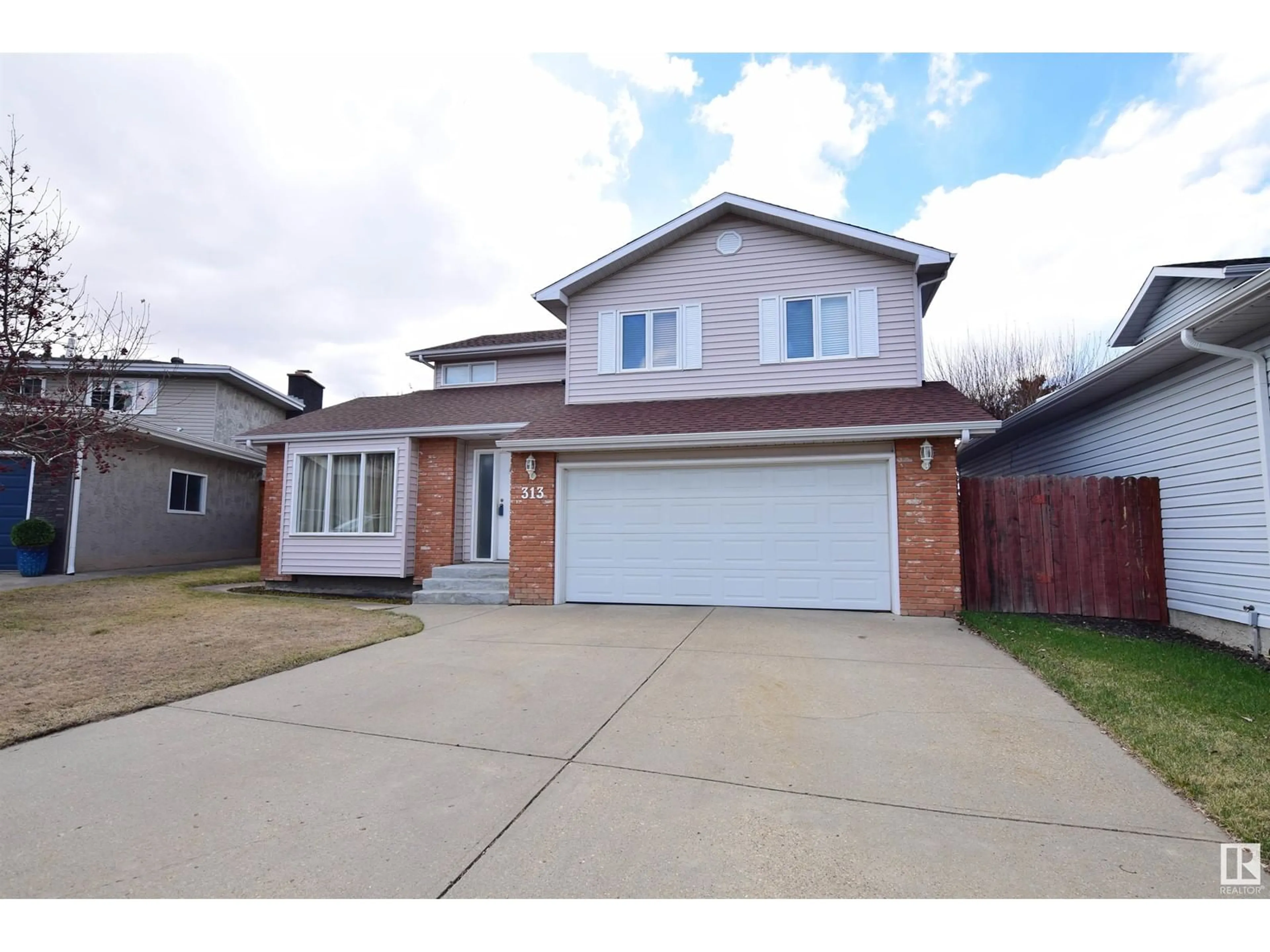 Home with brick exterior material, street for 313 GRAND MEADOW CR, Edmonton Alberta T6L1W9