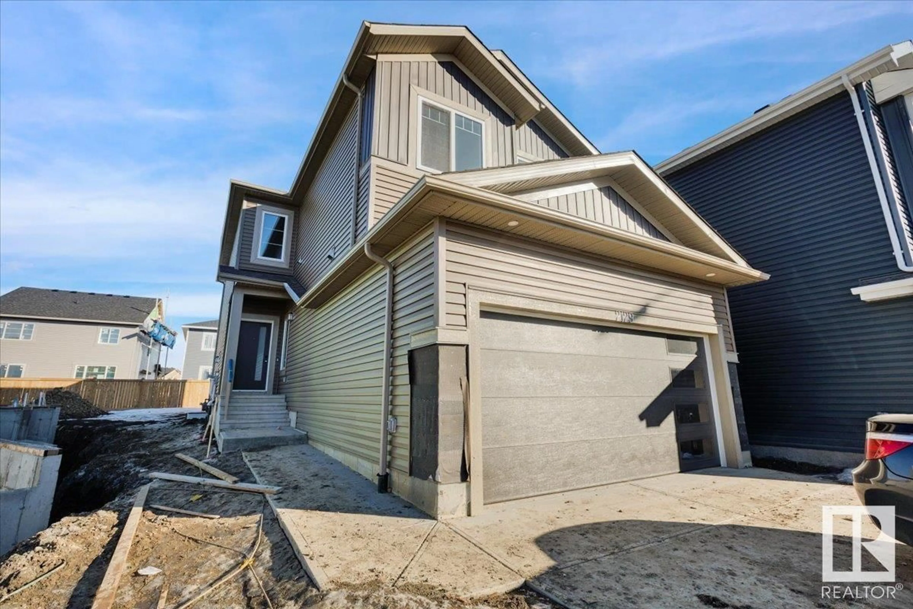 Home with vinyl exterior material, street for NW - 2129 209A ST, Edmonton Alberta T6M3C7