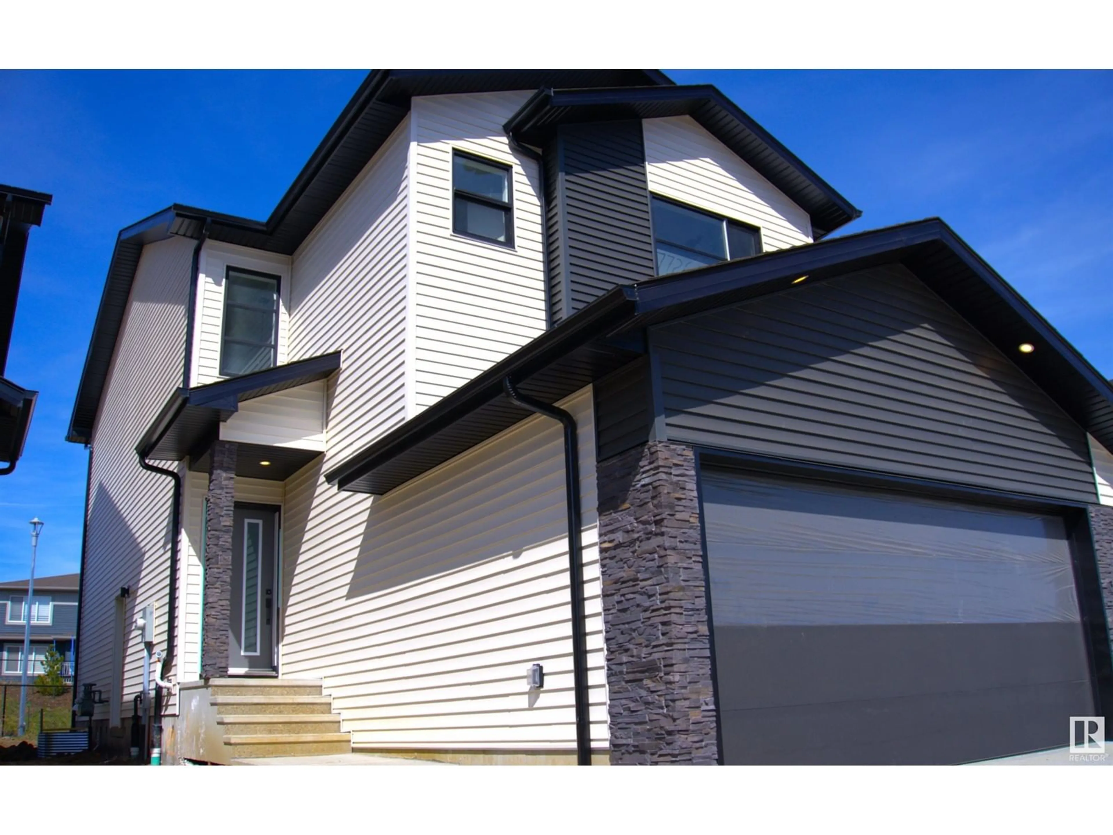 Home with vinyl exterior material, street for 7726 174A AV NW, Edmonton Alberta T5Z0W5
