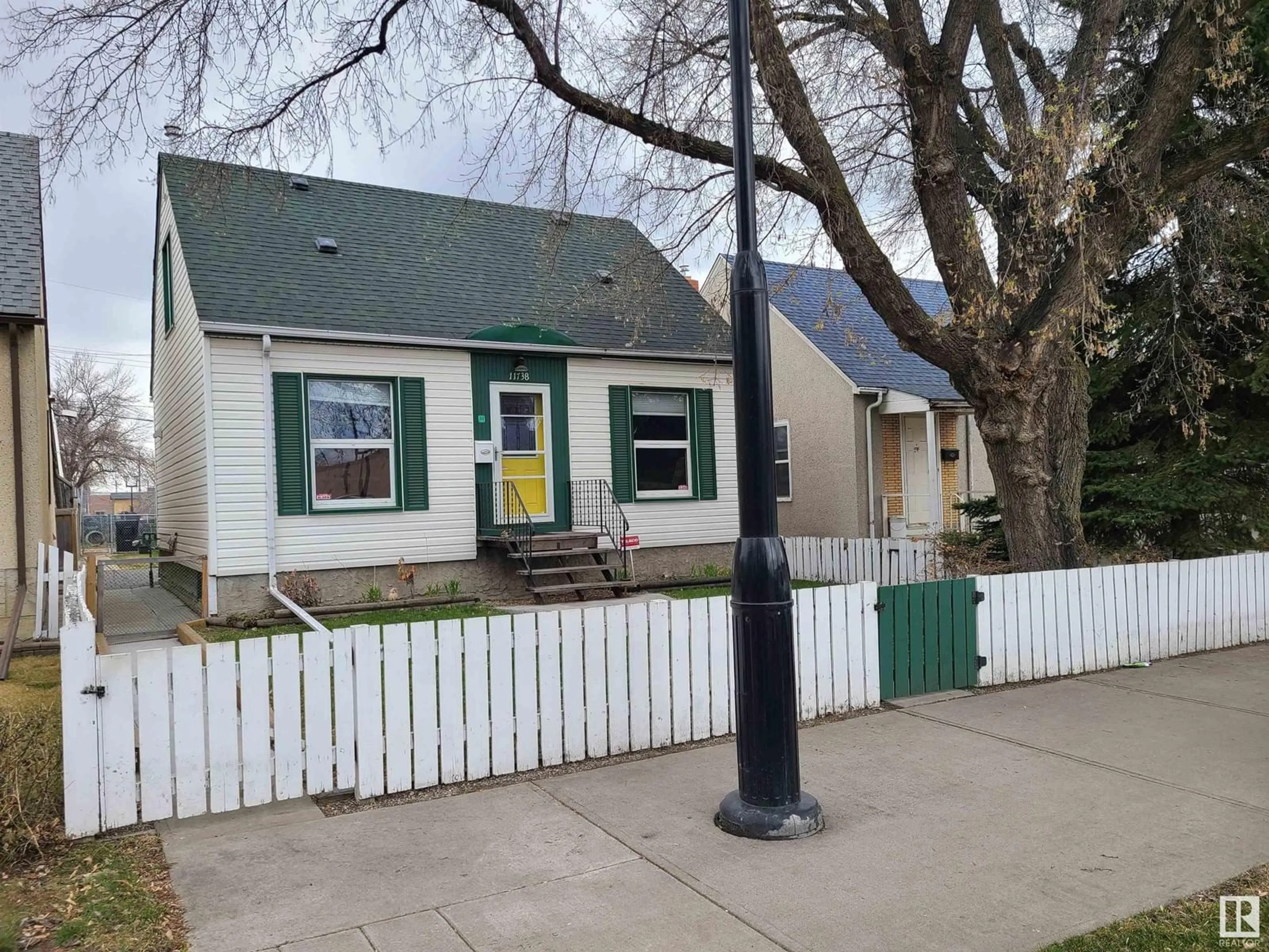 Home with vinyl exterior material, street for NW - 11738 86 ST, Edmonton Alberta T5B3J8