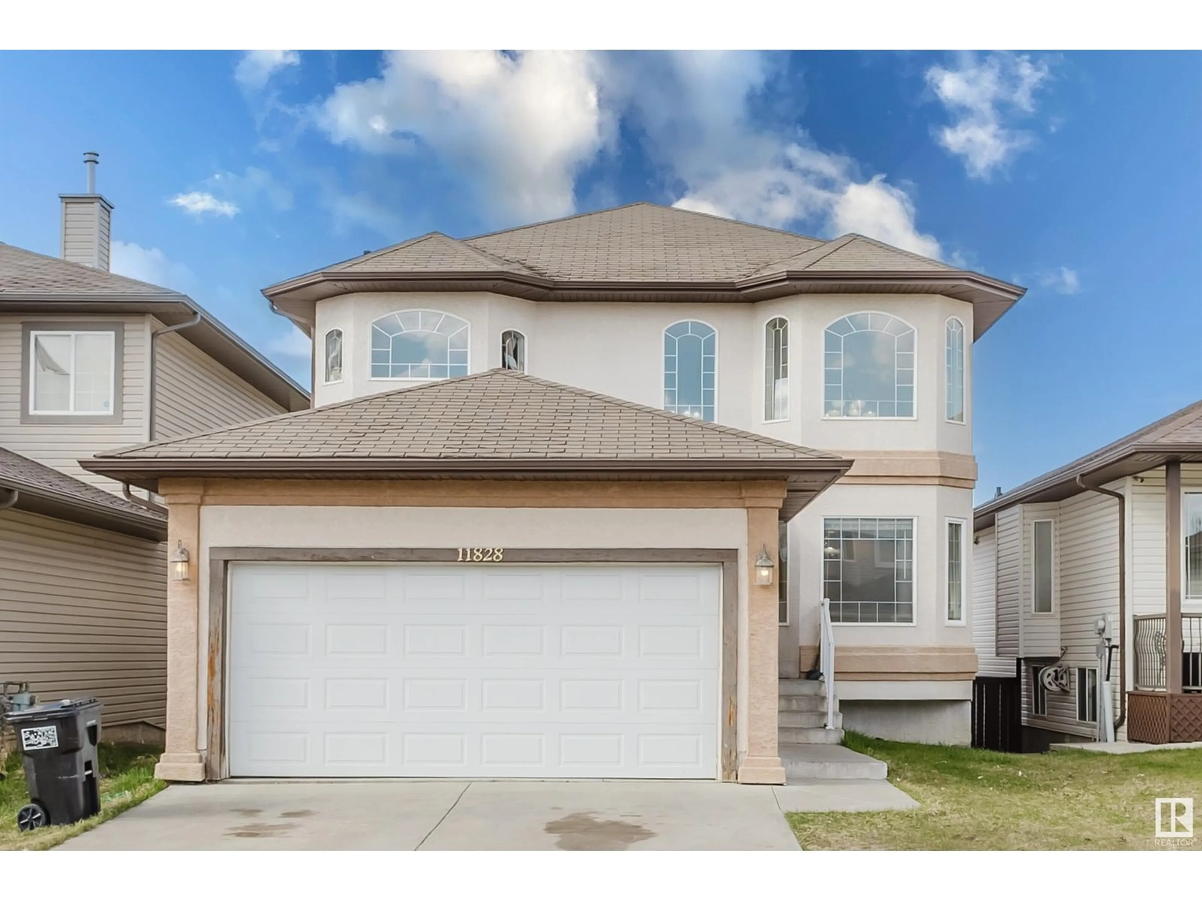 Home with vinyl exterior material, street for 11828 173 AV, Edmonton Alberta T5X6G1