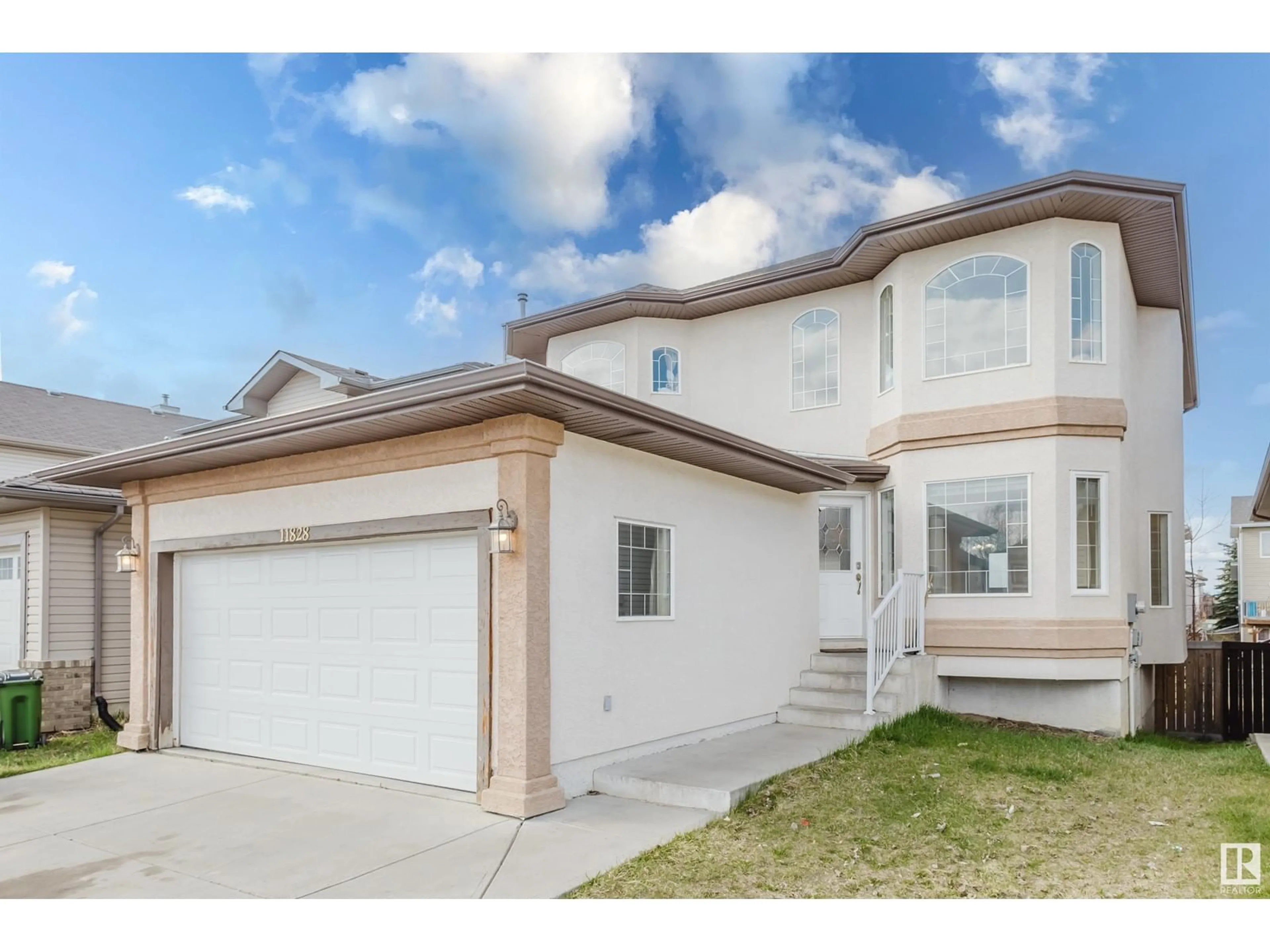 Home with vinyl exterior material, street for 11828 173 AV, Edmonton Alberta T5X6G1