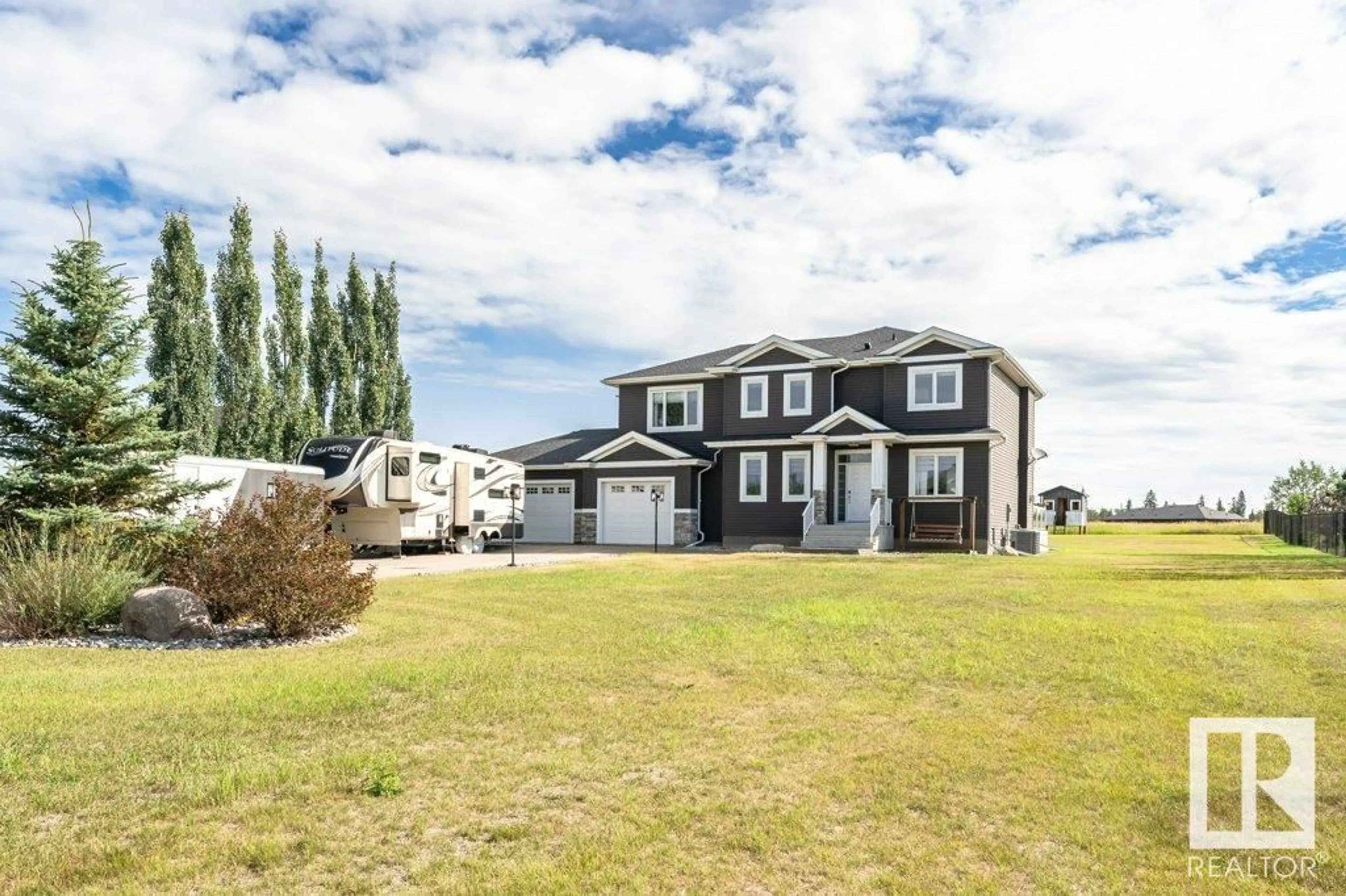A pic from outside/outdoor area/front of a property/back of a property/a pic from drone, unknown for 20-26409 TWP 532A RD, Rural Parkland County Alberta T7X0W7