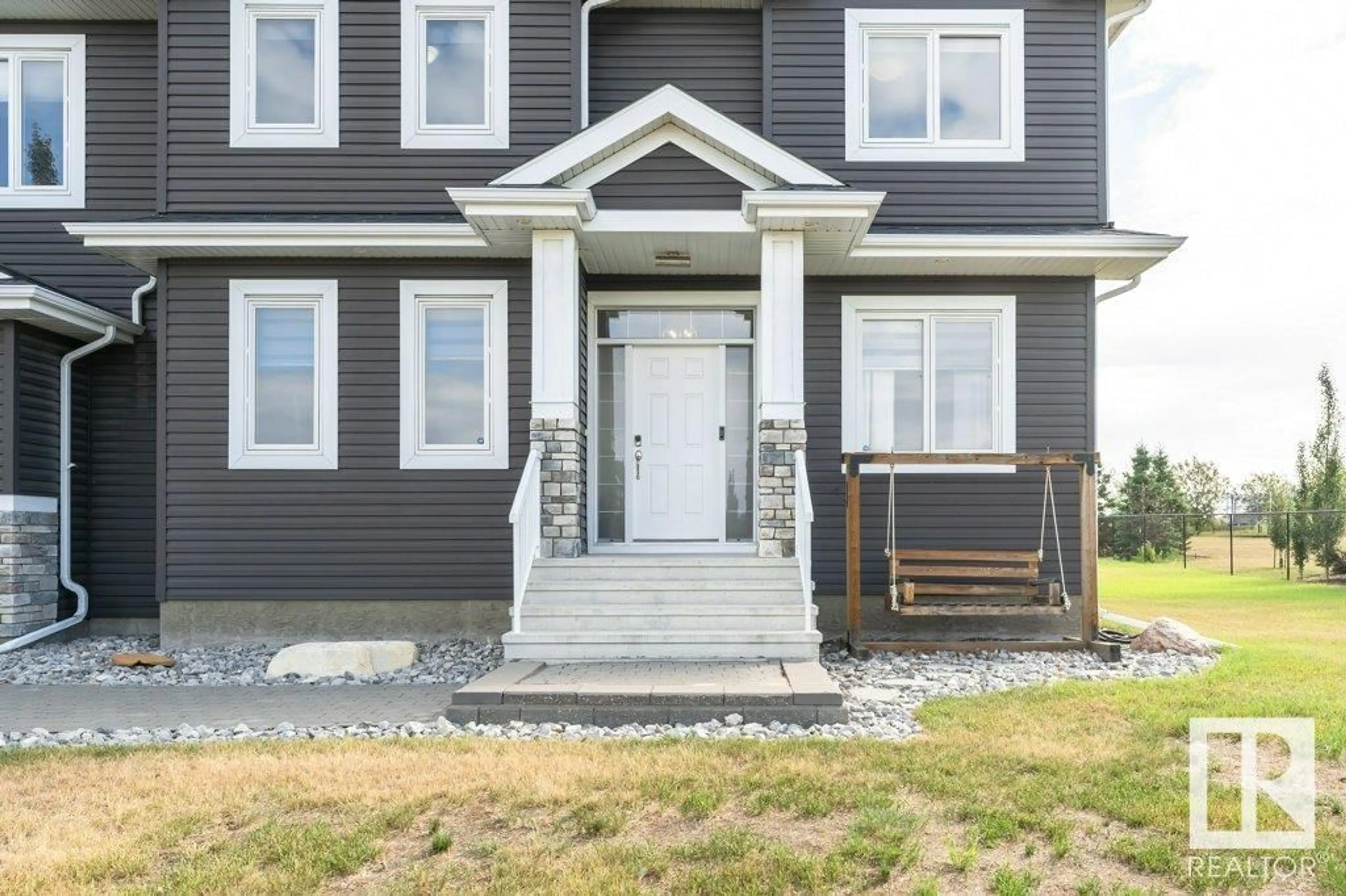 Home with vinyl exterior material, street for 20-26409 TWP 532A RD, Rural Parkland County Alberta T7X0W7