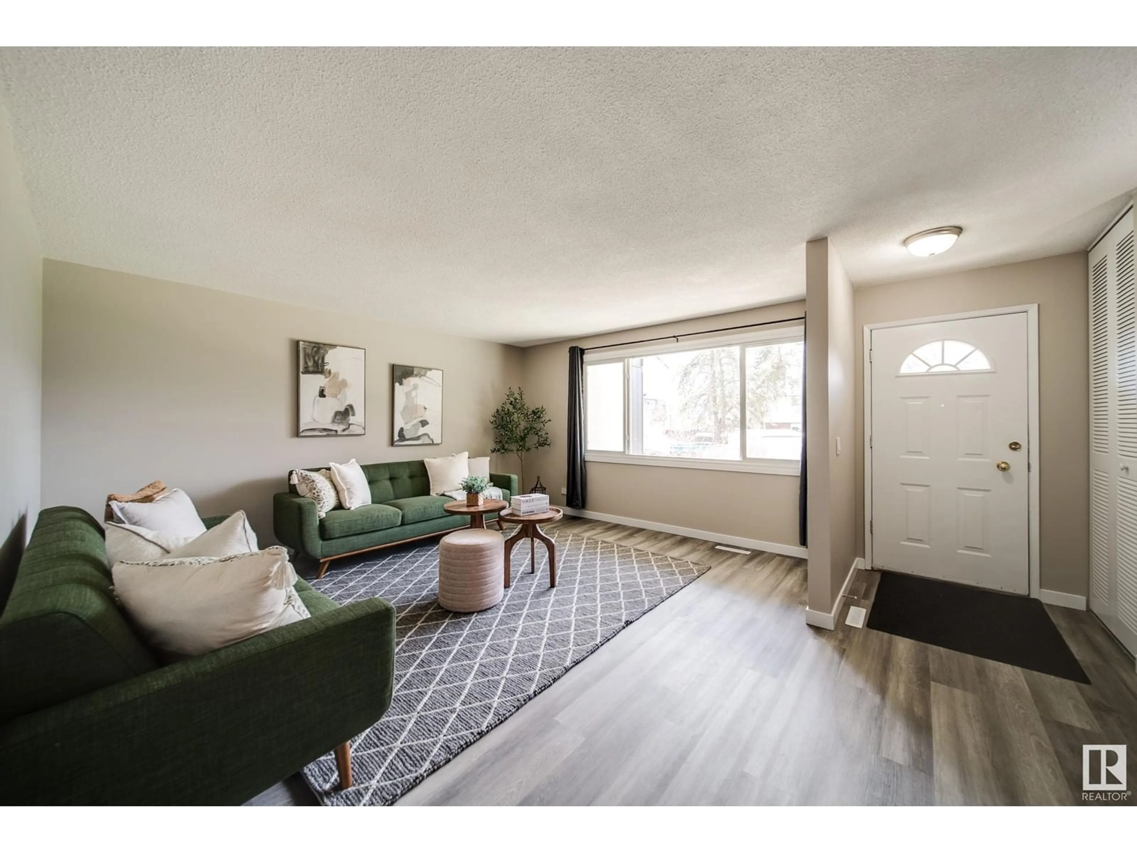 Living room with furniture, unknown for NW - 5719 144 AV, Edmonton Alberta T5A1K6