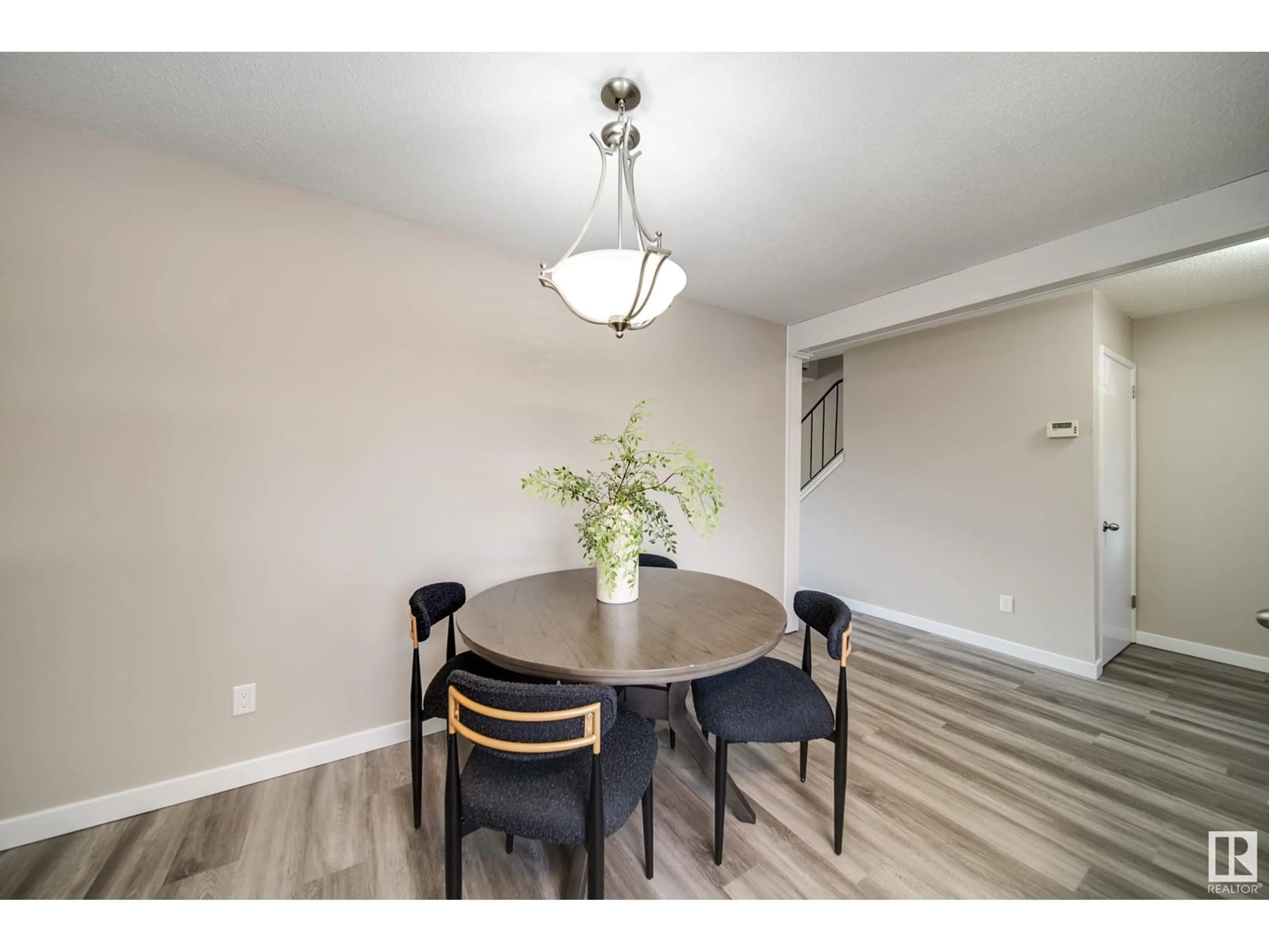 Dining room, wood/laminate floor for NW - 5719 144 AV, Edmonton Alberta T5A1K6
