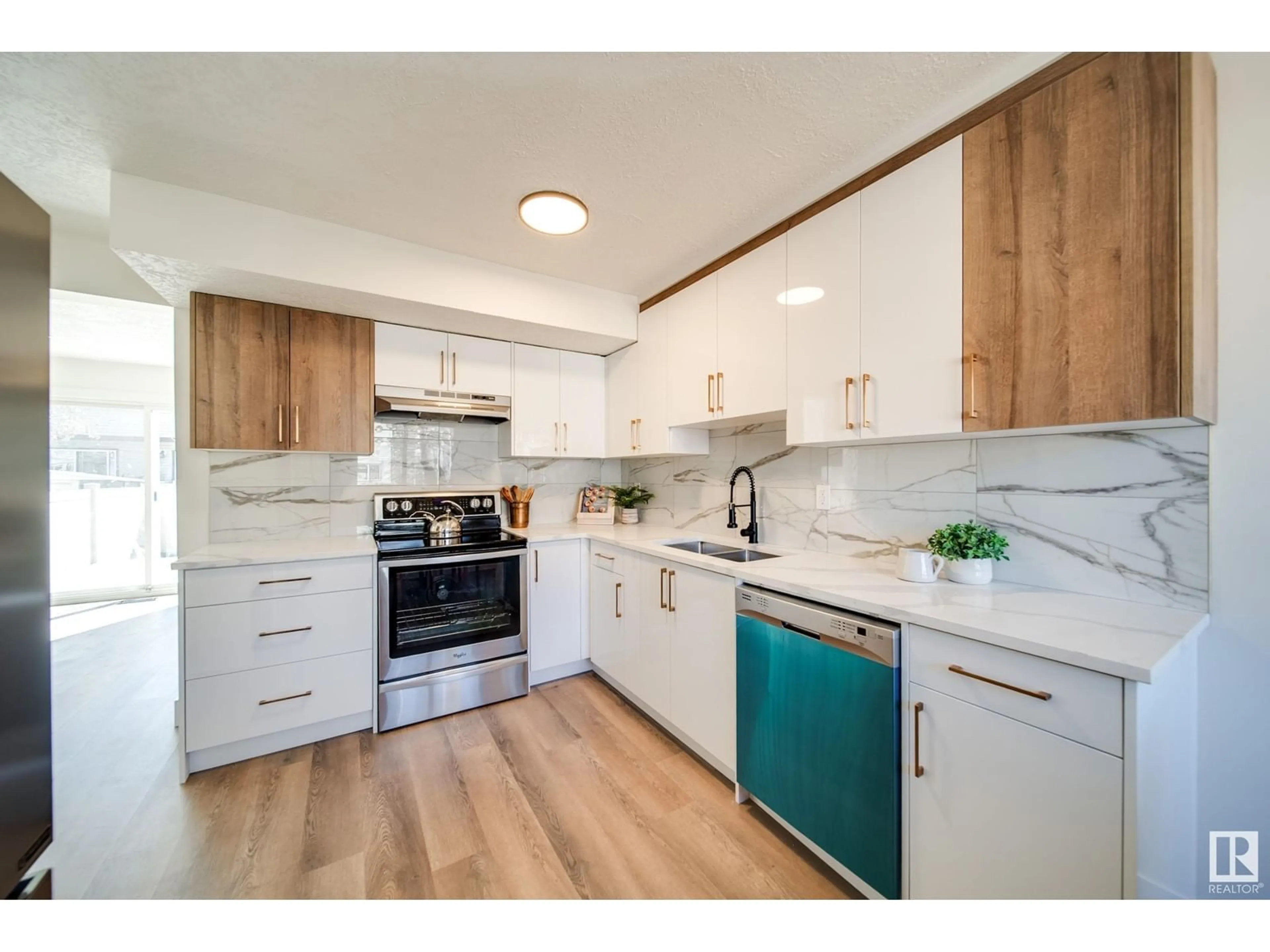 Open concept kitchen, wood/laminate floor for 1237 HOOKE RD, Edmonton Alberta T5Z4A4