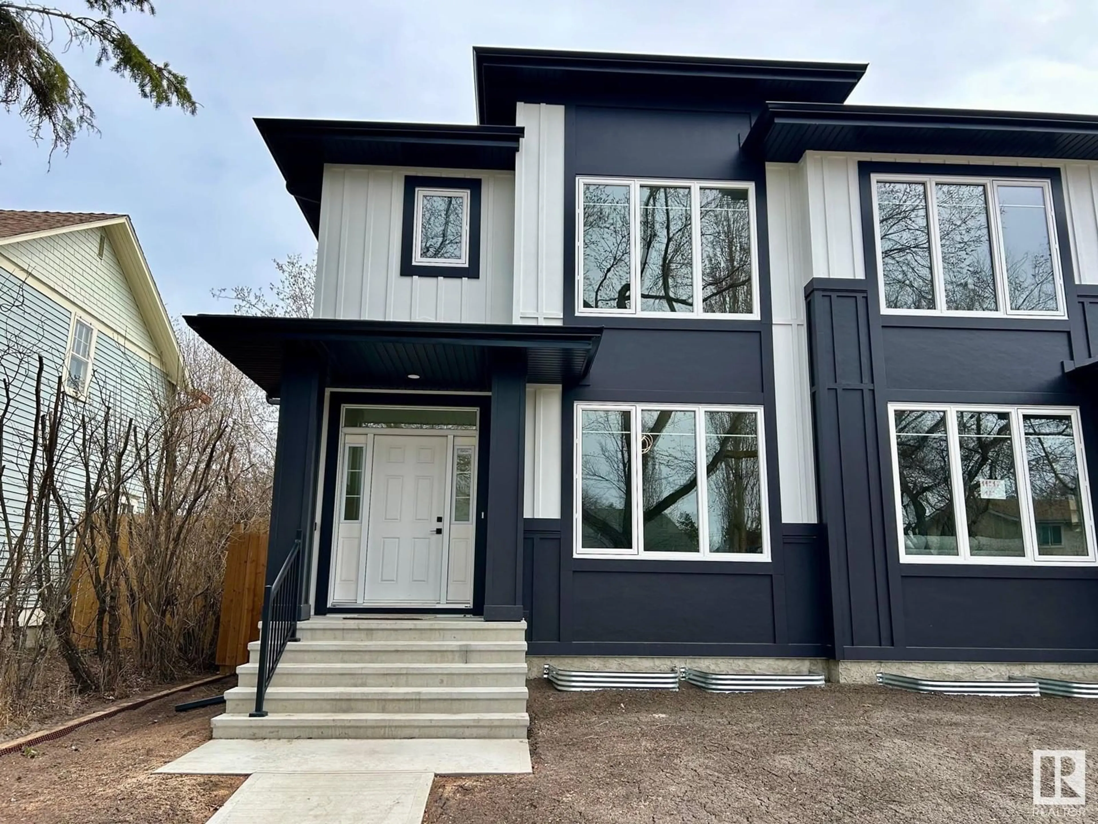 Home with vinyl exterior material, street for NW - 11219 125 ST, Edmonton Alberta T5M0M6