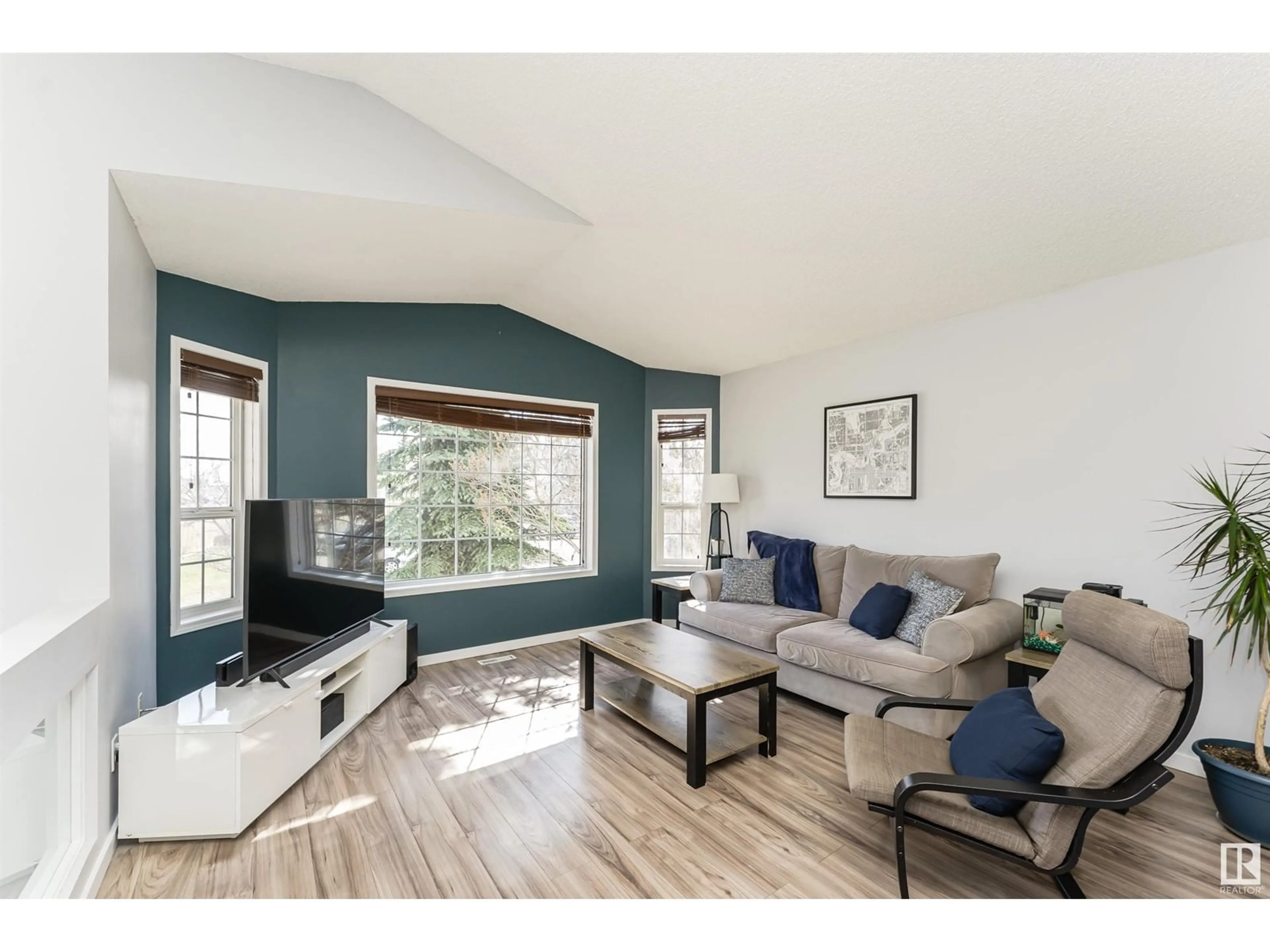 Living room with furniture, wood/laminate floor for 4274 23 ST, Edmonton Alberta T6T1M1