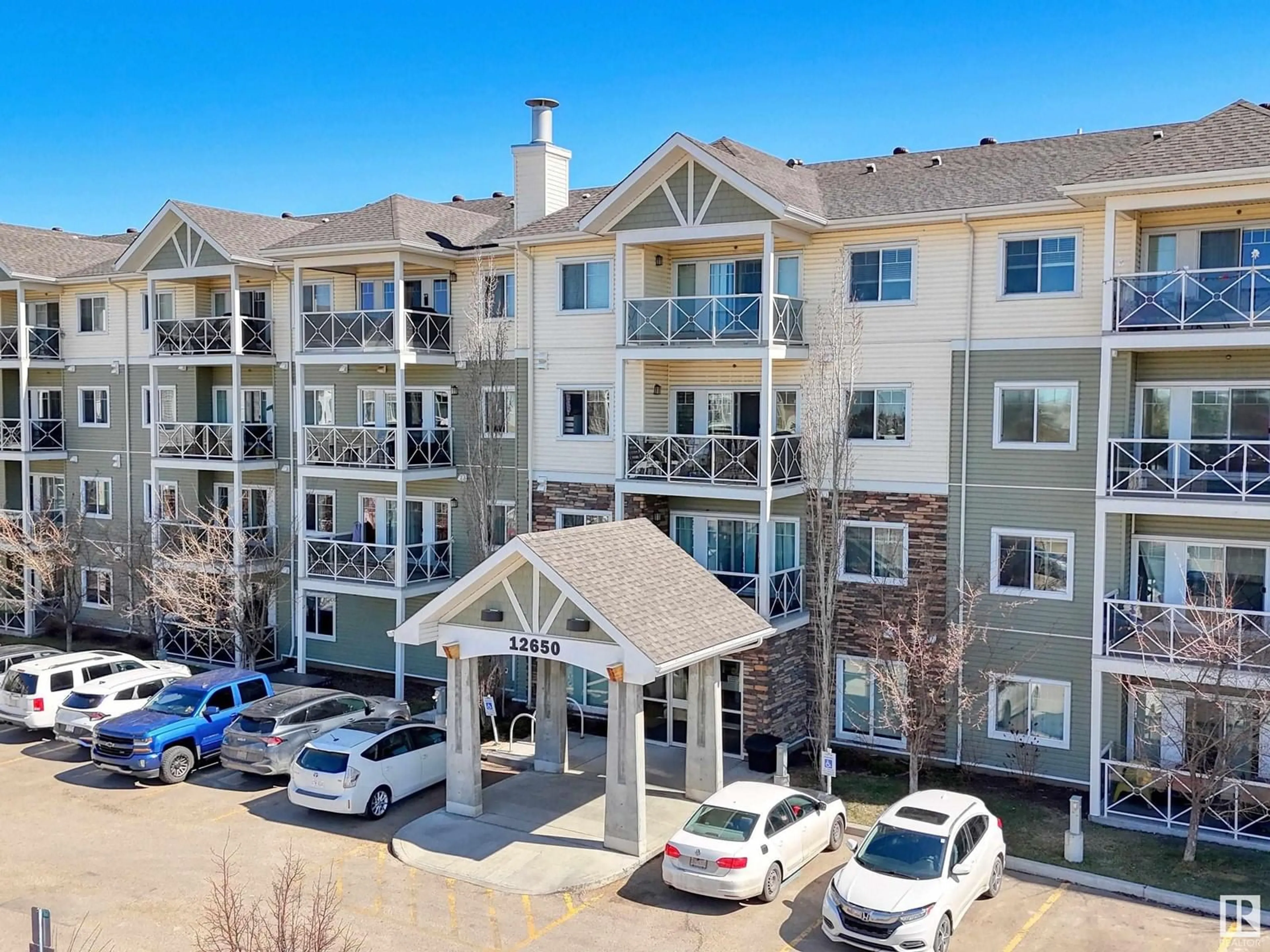 A pic from outside/outdoor area/front of a property/back of a property/a pic from drone, mountain view for #103 - 12650 142 AV NW, Edmonton Alberta T5X0J4