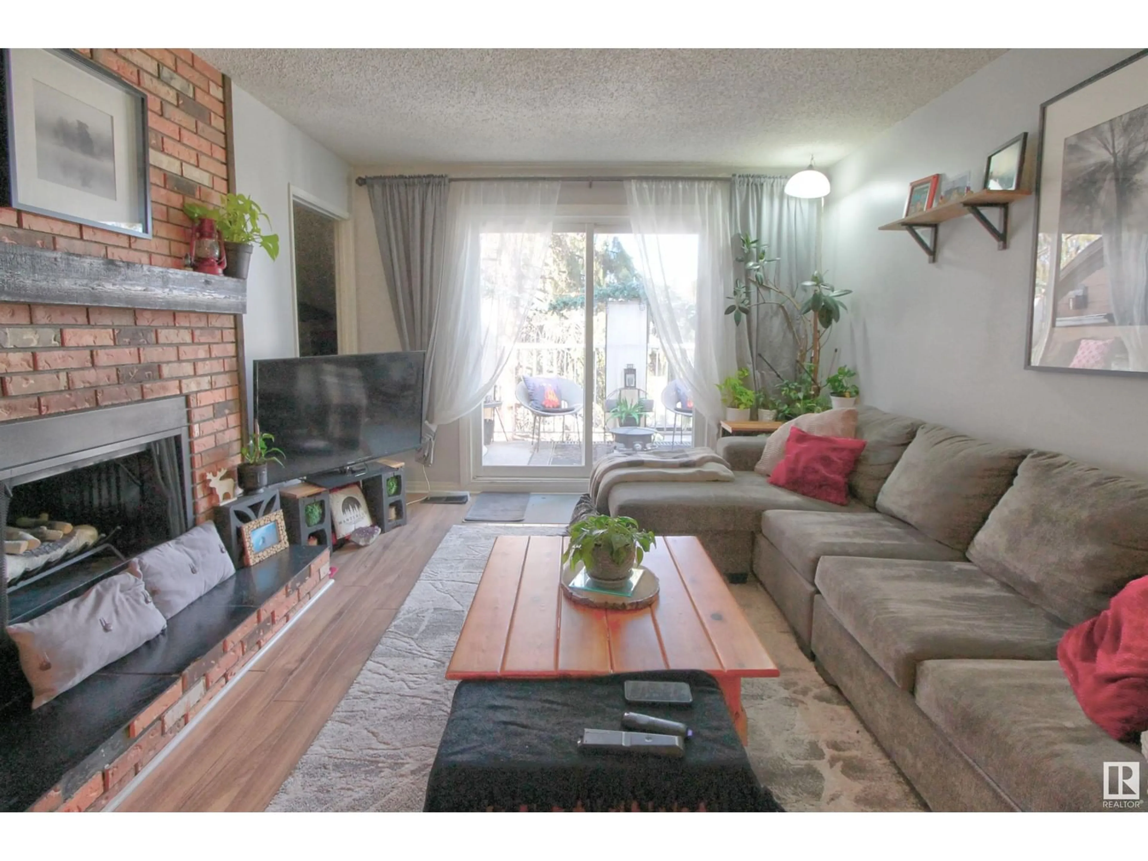 Living room with furniture, wood/laminate floor for #306 - 22 ALPINE PL, St. Albert Alberta T8N3Y2