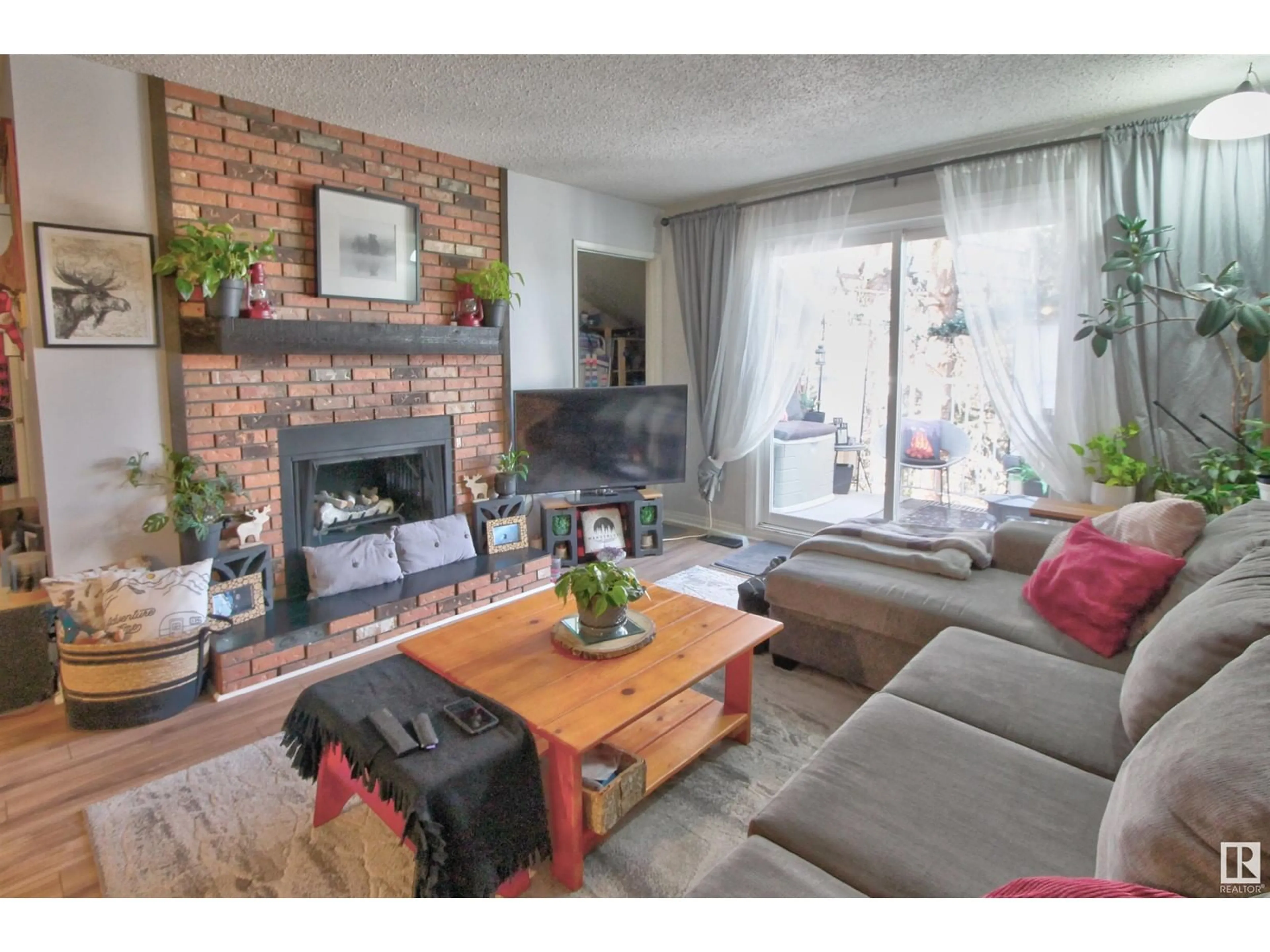Living room with furniture, wood/laminate floor for #306 - 22 ALPINE PL, St. Albert Alberta T8N3Y2