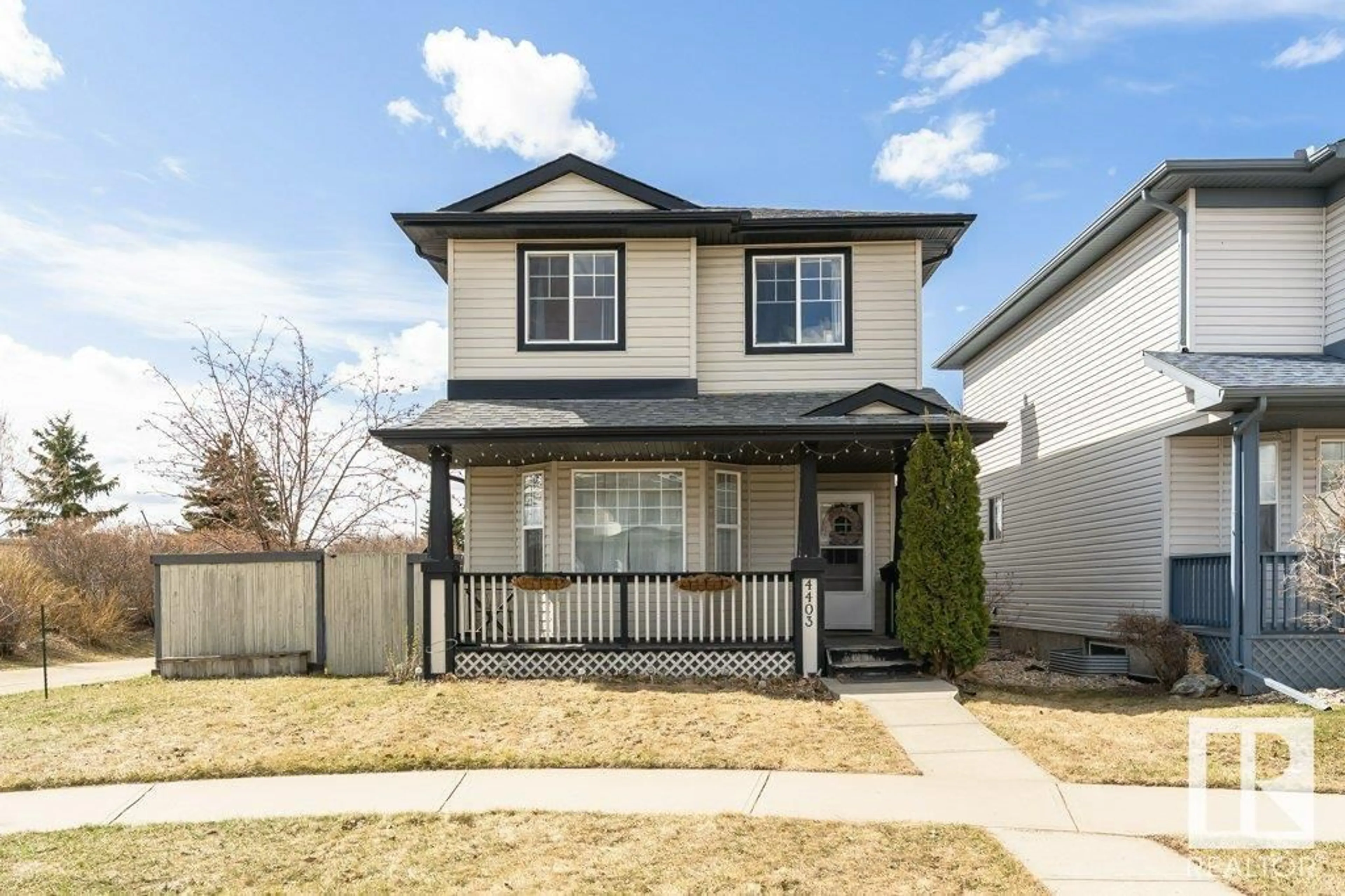 Home with vinyl exterior material, street for 4403 150 AV, Edmonton Alberta T5Y2Z8