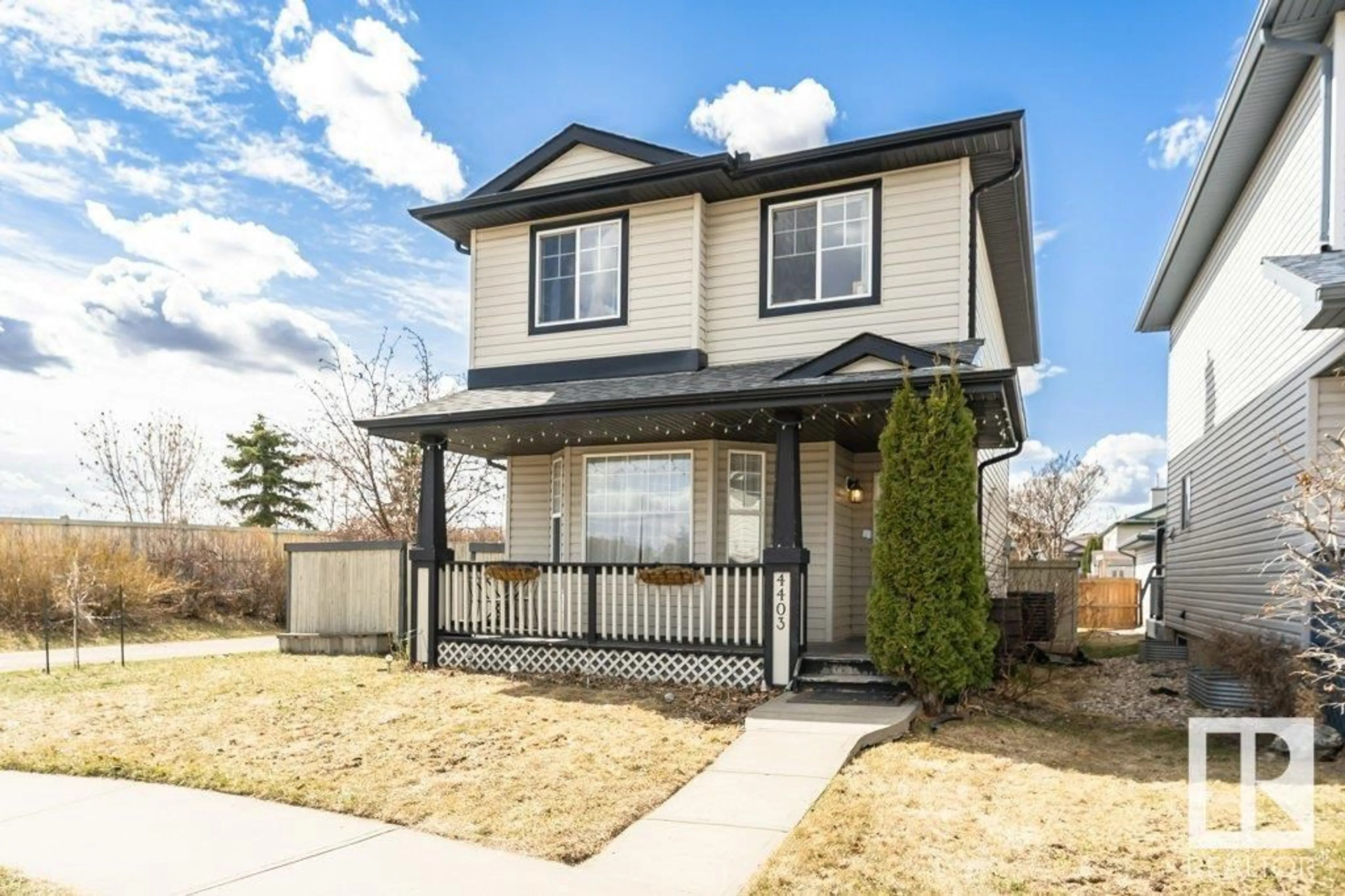 Home with vinyl exterior material, street for 4403 150 AV, Edmonton Alberta T5Y2Z8