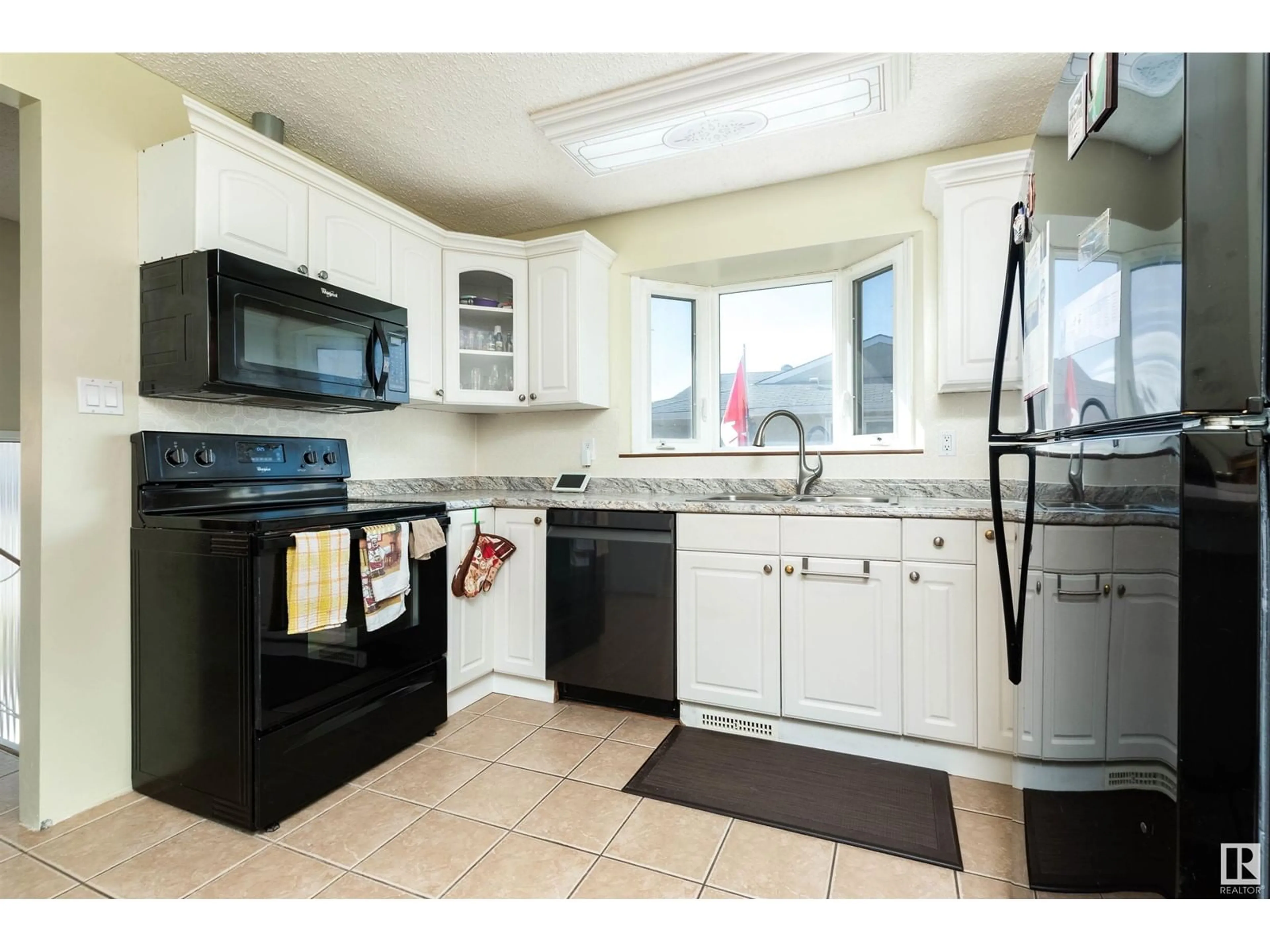 Standard kitchen, ceramic/tile floor for 13216 38 ST NW, Edmonton Alberta T5A3G4