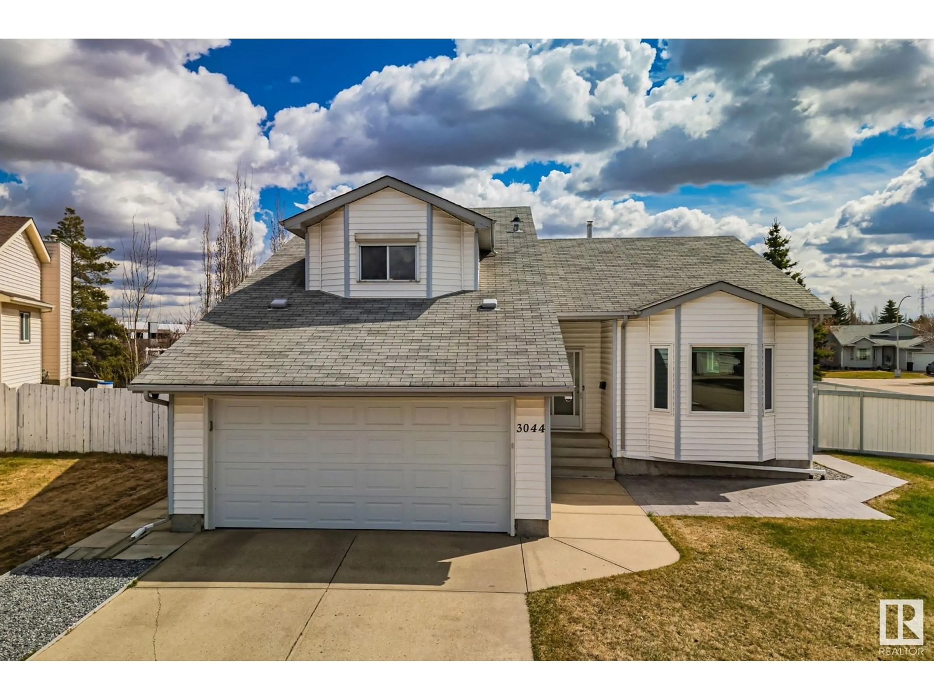 Home with vinyl exterior material, street for NW - 3044 44B AV, Edmonton Alberta T6T1G4