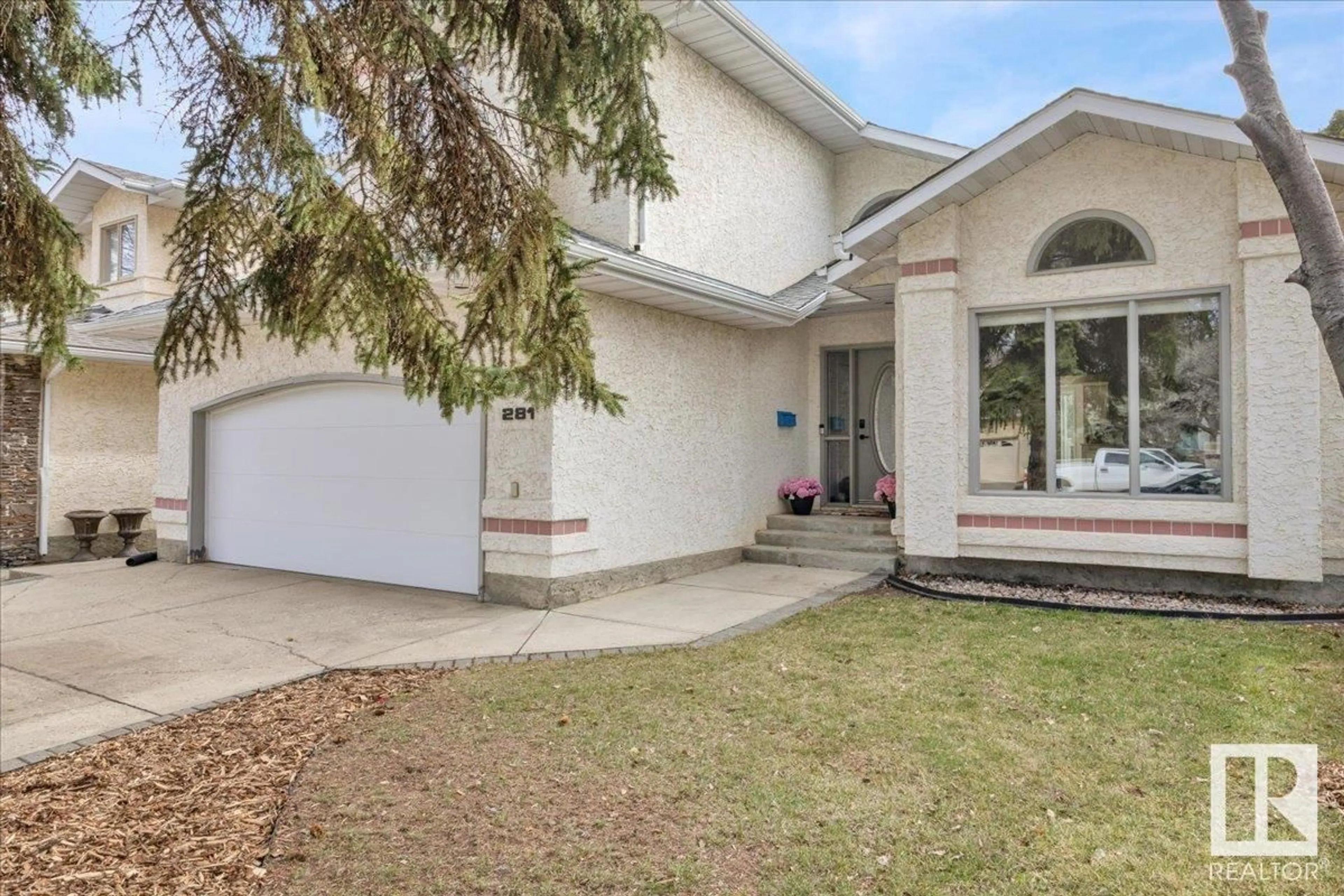 Home with vinyl exterior material, street for 281 HEATH RD, Edmonton Alberta T6R1V4
