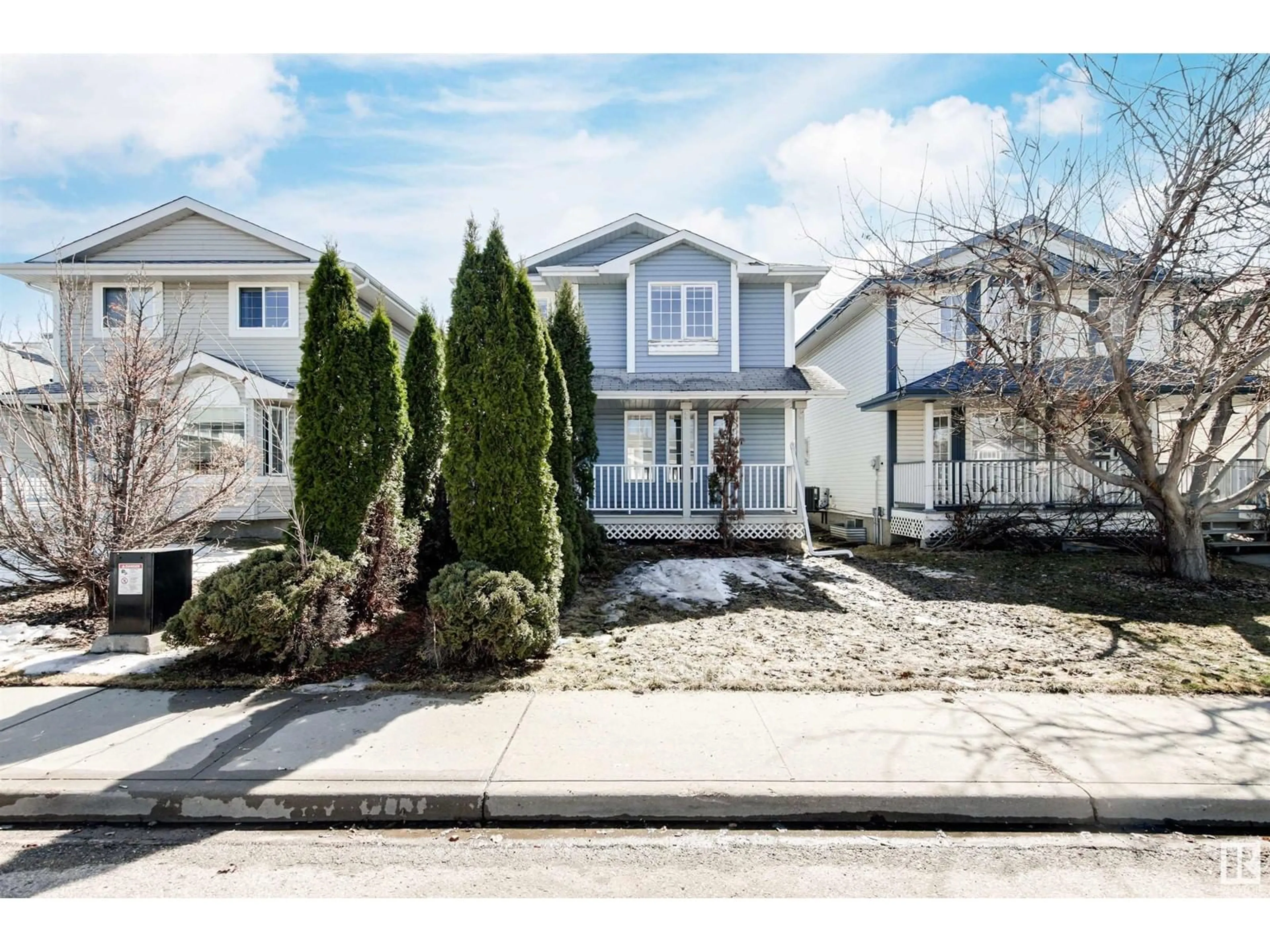 Home with vinyl exterior material, street for 11823 9 AV, Edmonton Alberta T6J7A1