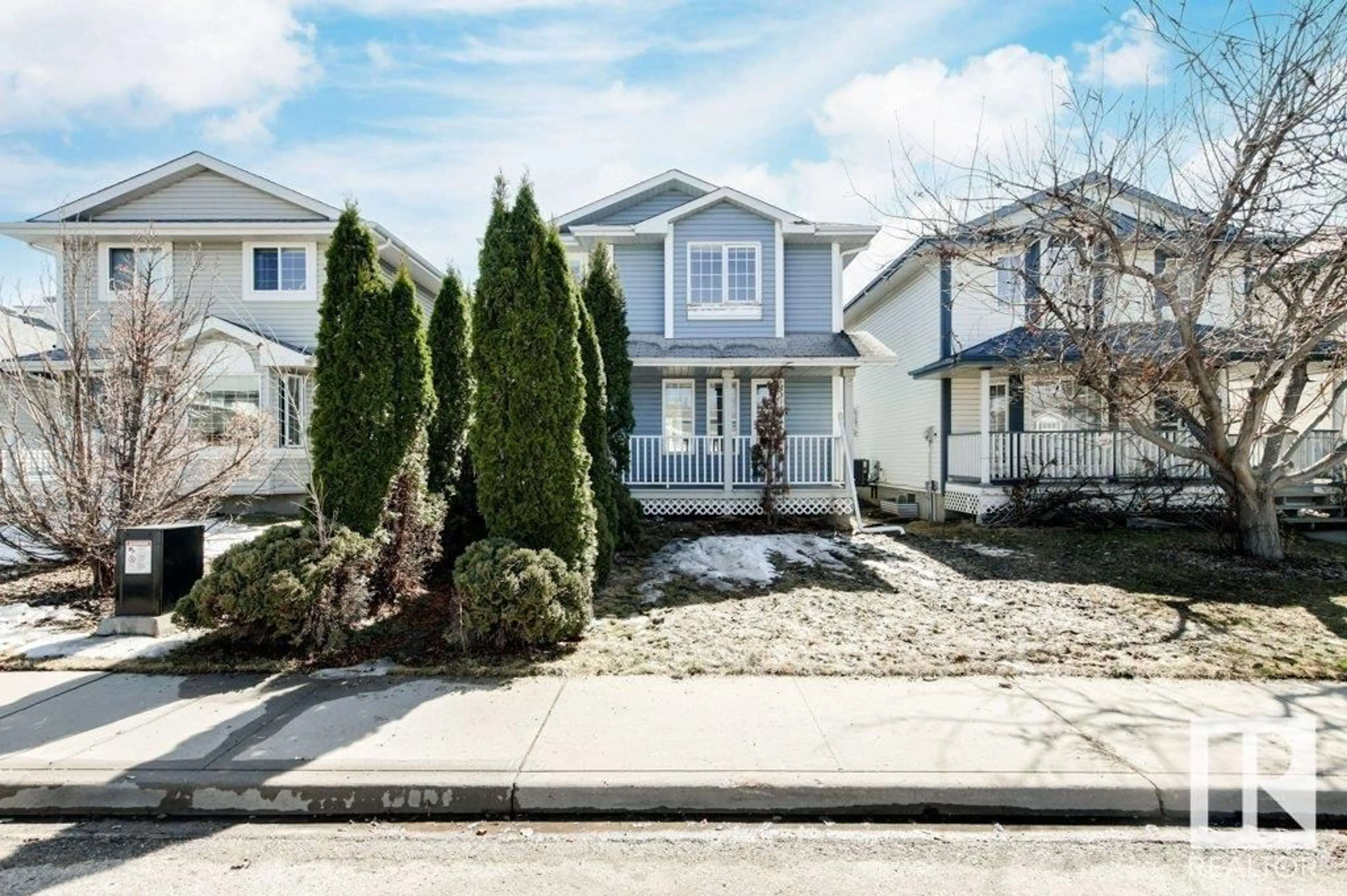 Home with vinyl exterior material, street for 11823 9 AV, Edmonton Alberta T6J7A1