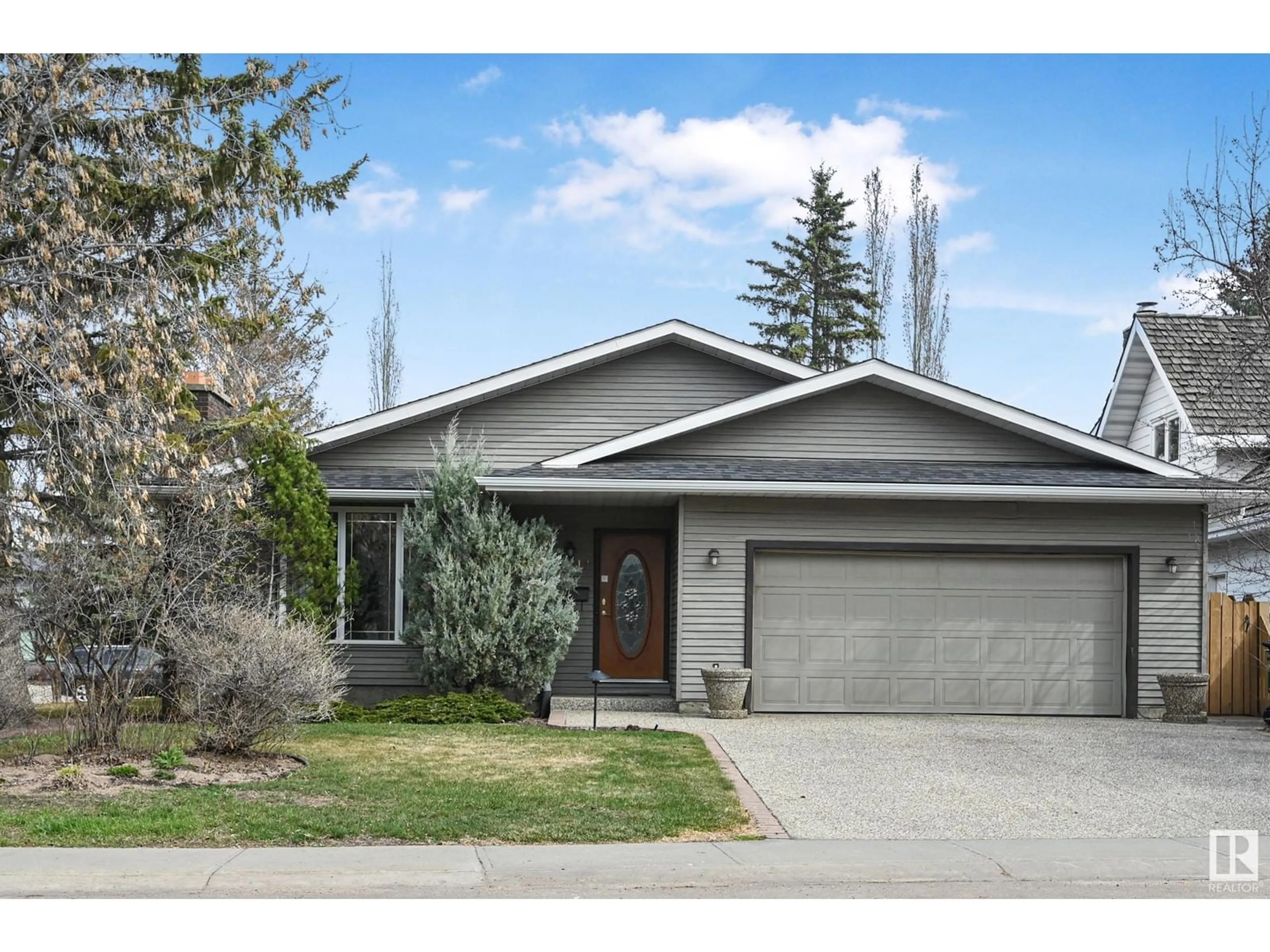 Home with vinyl exterior material, street for NW - 11212 22 AV, Edmonton Alberta T6J4V3