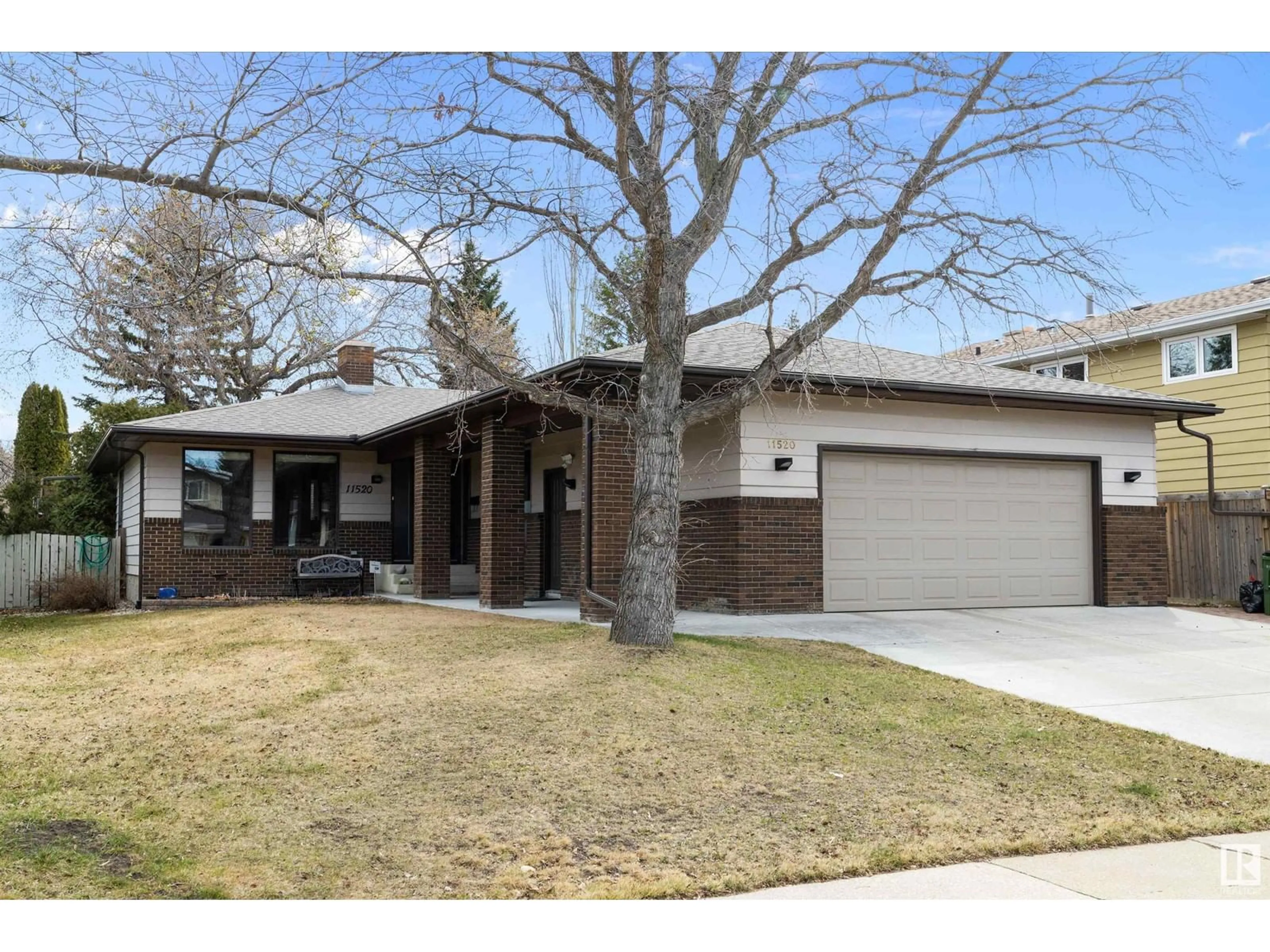 Home with brick exterior material, street for NW - 11520 24 AV, Edmonton Alberta T6J3R7