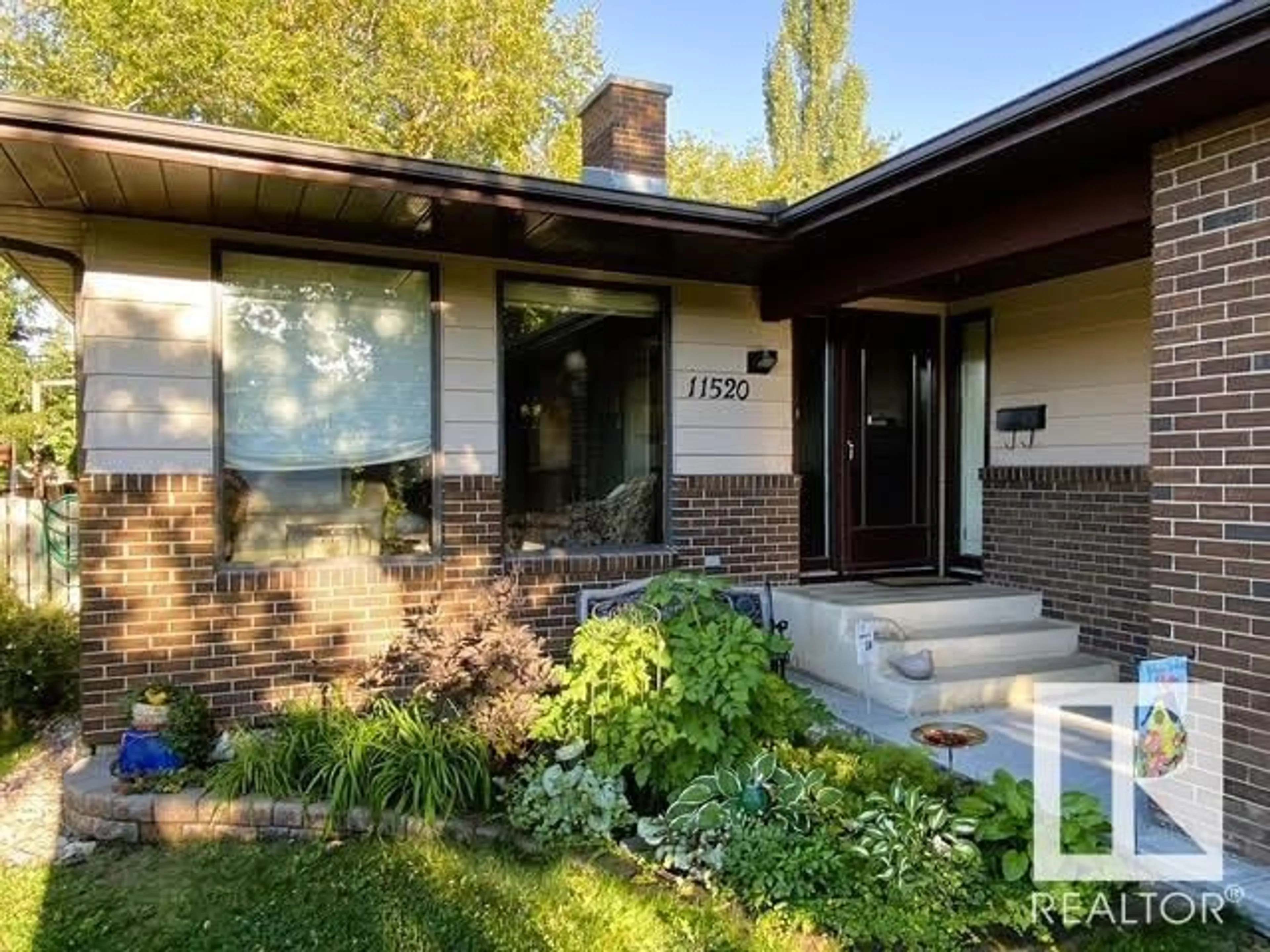 Home with brick exterior material, street for NW - 11520 24 AV, Edmonton Alberta T6J3R7