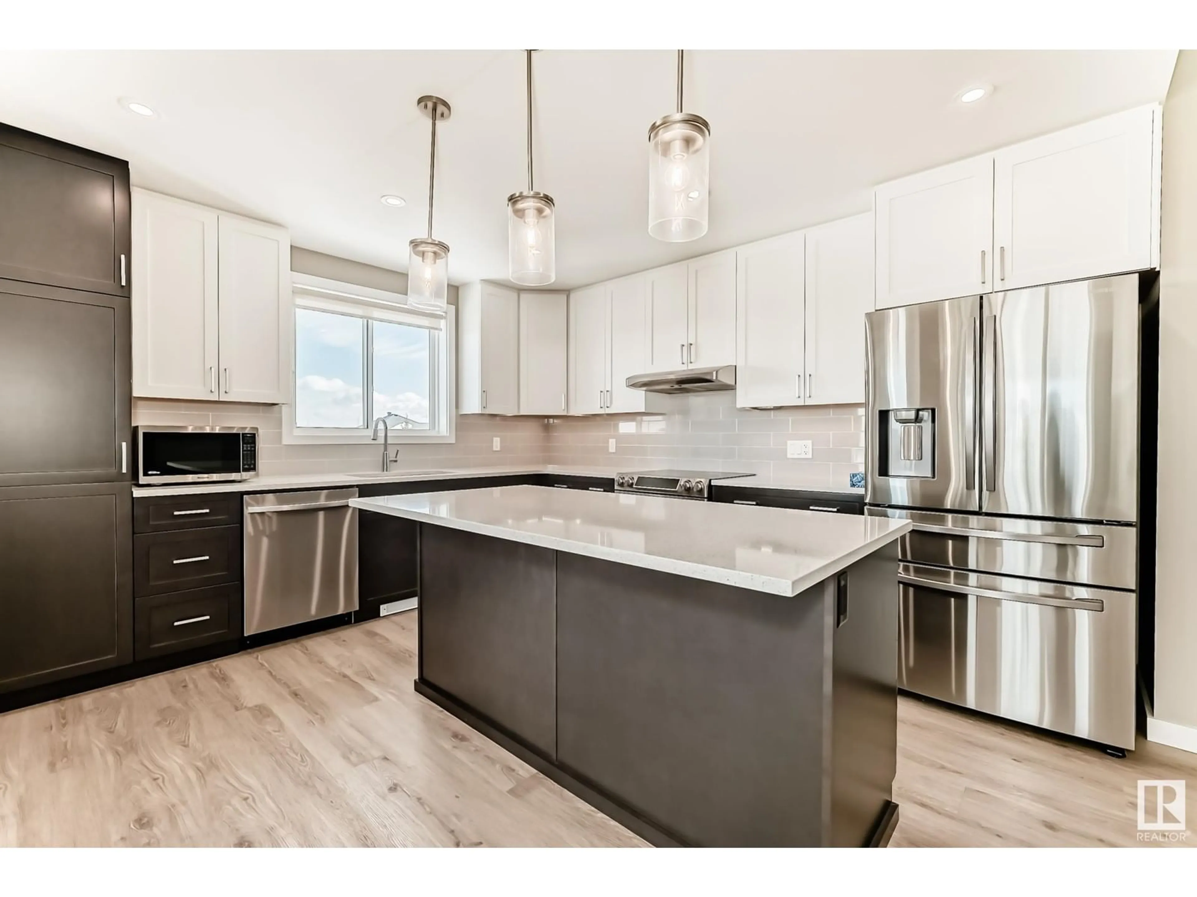 Open concept kitchen, wood/laminate floor for 1154 - 340 ADAMSON DR, Edmonton Alberta T6W3N5