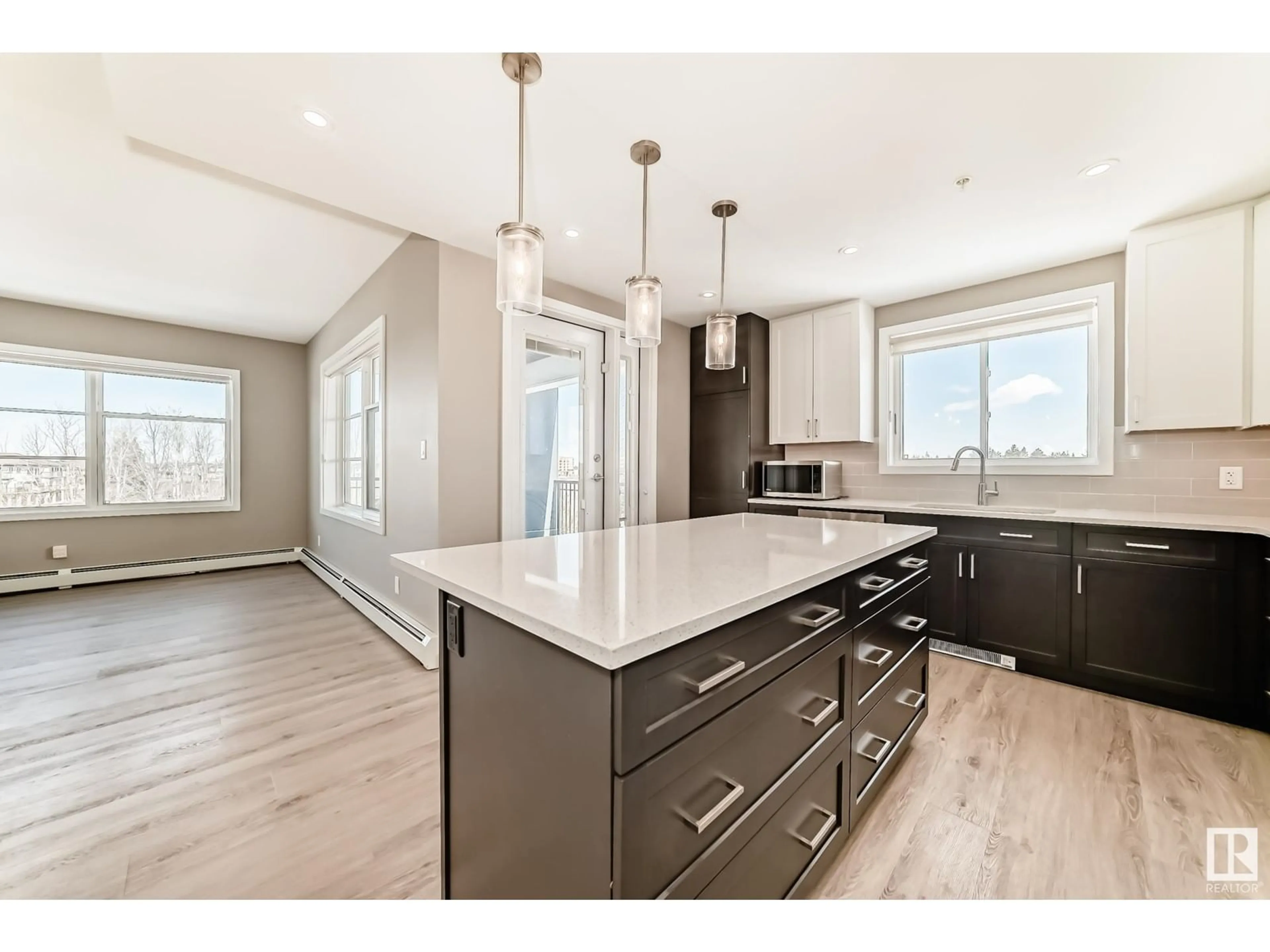 Open concept kitchen, wood/laminate floor for 1154 - 340 ADAMSON DR, Edmonton Alberta T6W3N5
