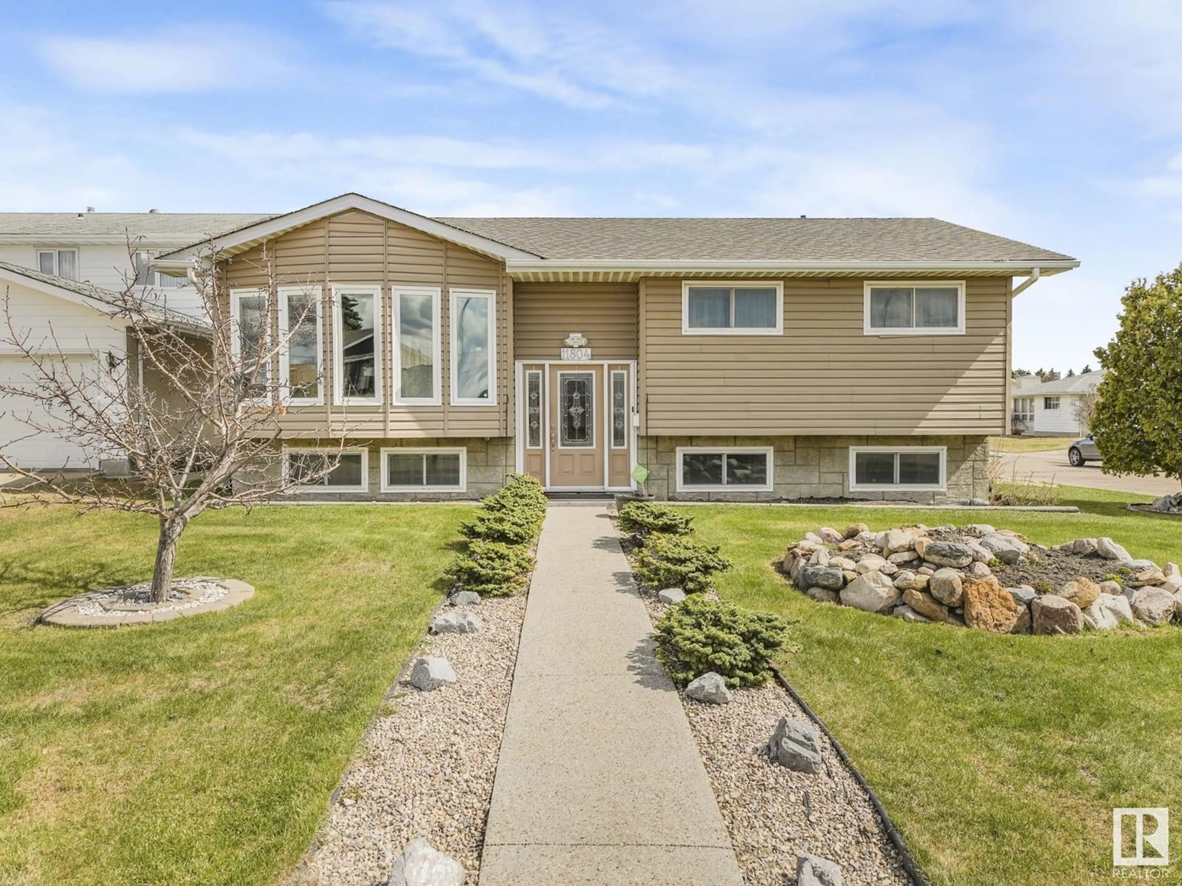 Home with vinyl exterior material, street for 11804 158 AV, Edmonton Alberta T5X2K4