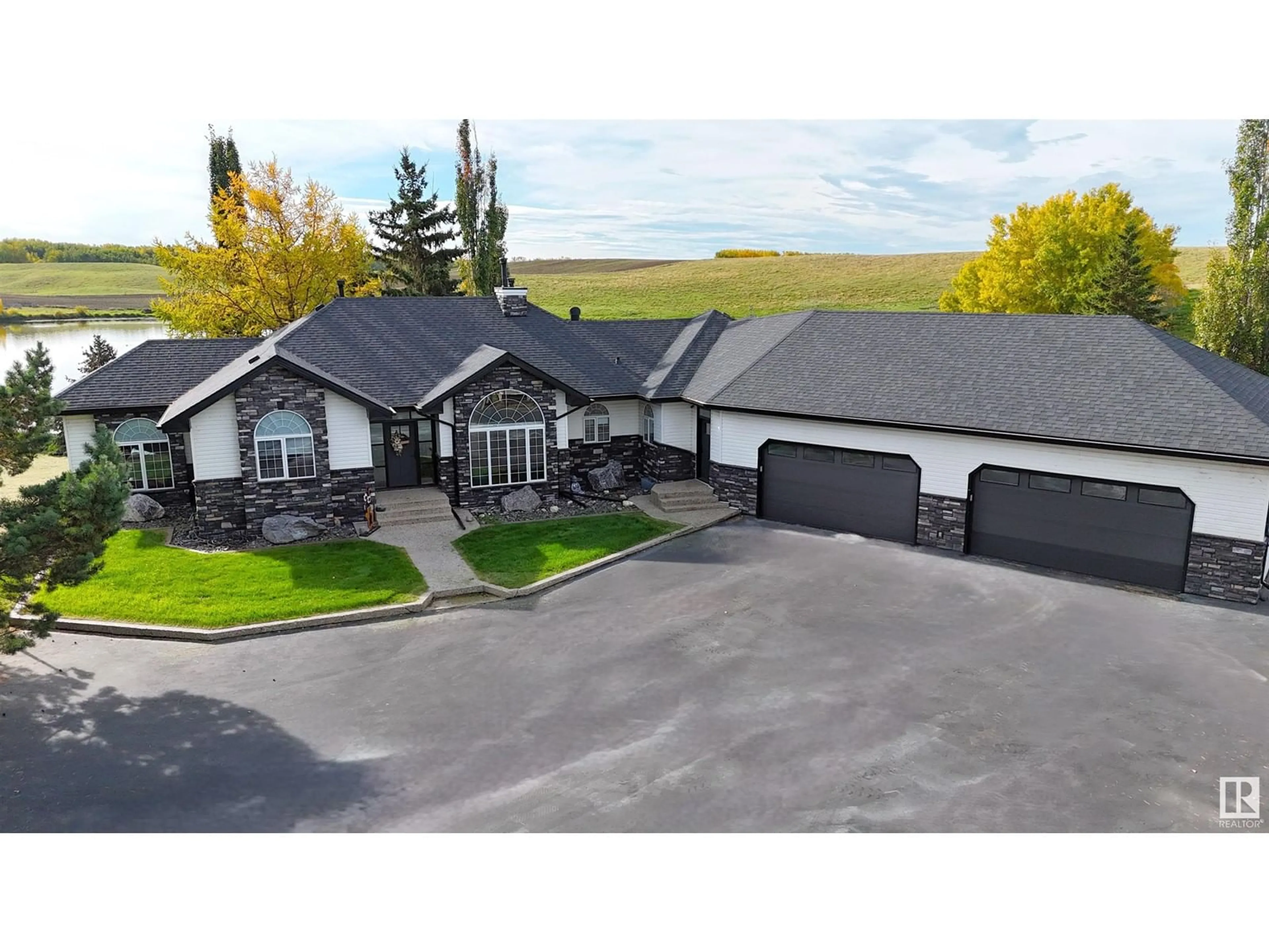 A pic from outside/outdoor area/front of a property/back of a property/a pic from drone, mountain view for #5 - 2022 PARKLAND DR, Rural Parkland County Alberta T0E0H0