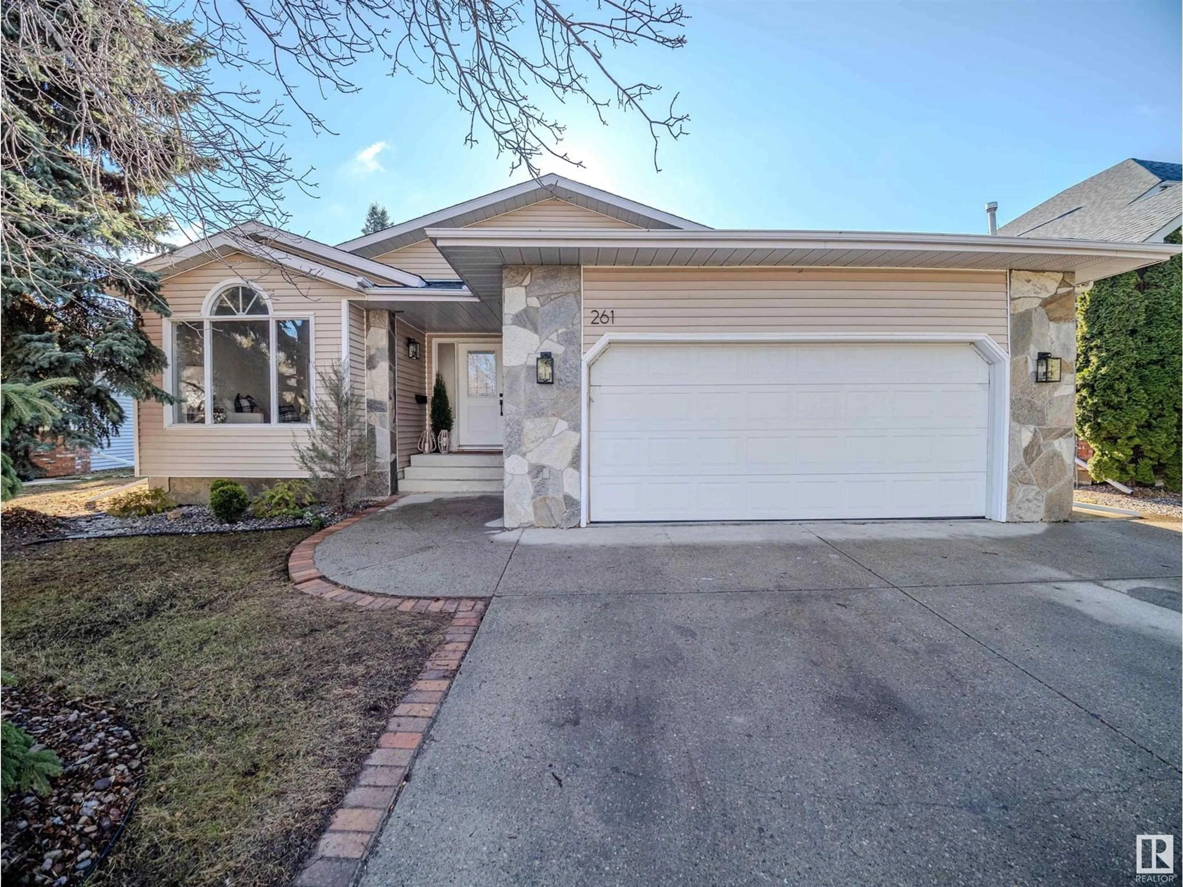Home with vinyl exterior material, street for 261 HEAGLE CR, Edmonton Alberta T6R1W2