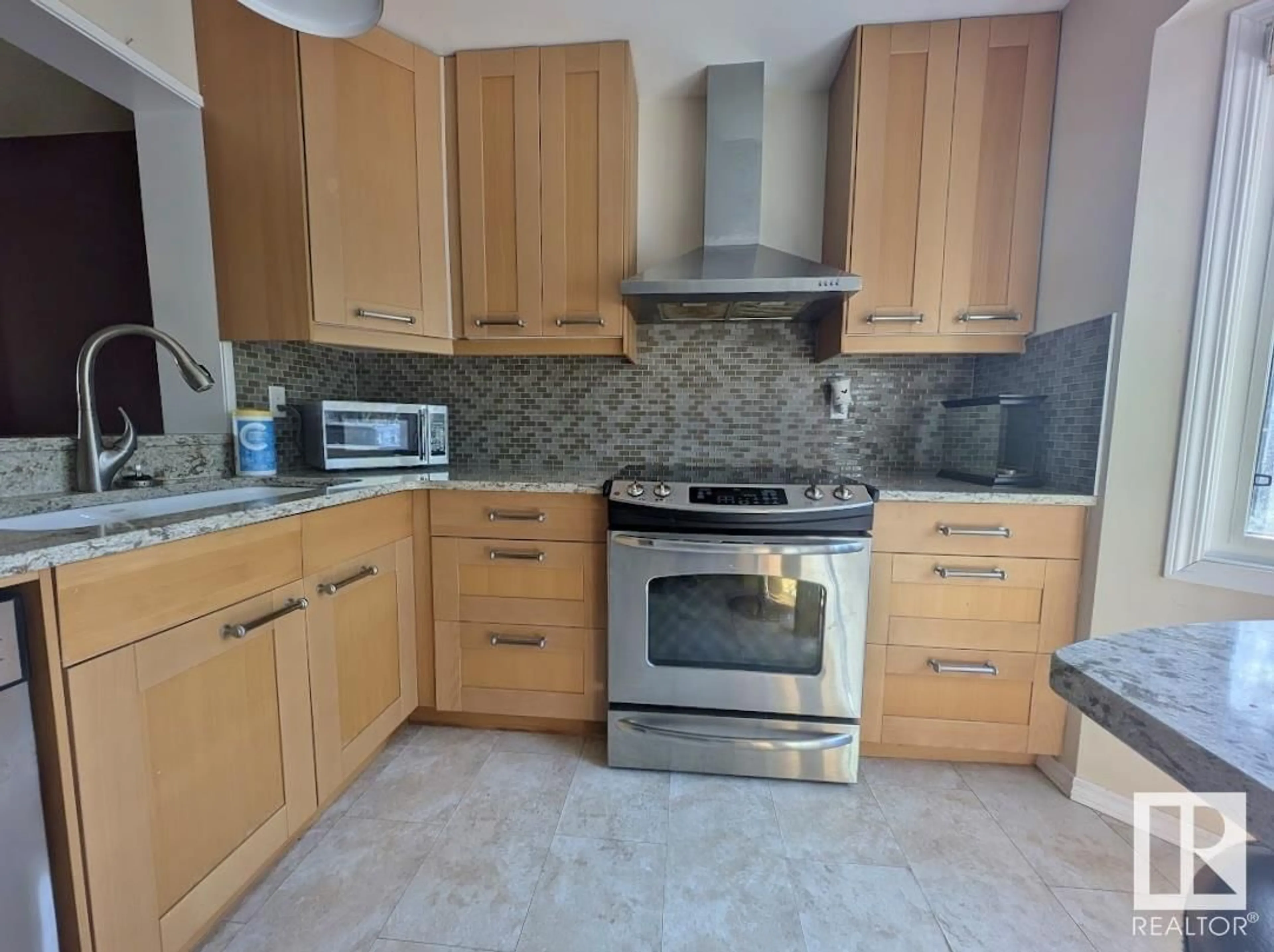 Standard kitchen, ceramic/tile floor for 2117 141 AV, Edmonton Alberta T5Y1C4