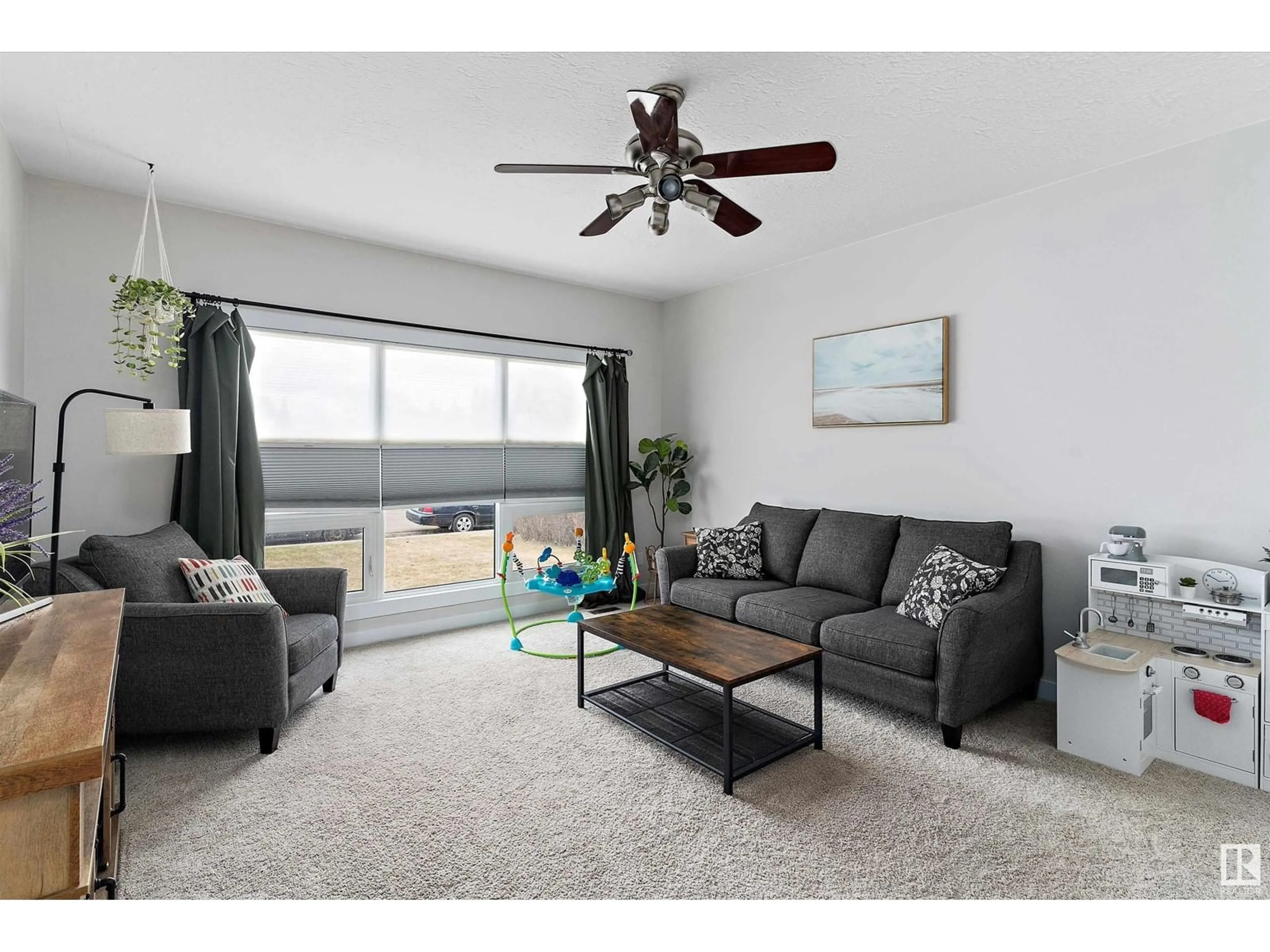 Living room with furniture, wood/laminate floor for 4807 56 AV, Tofield Alberta T0B4J0