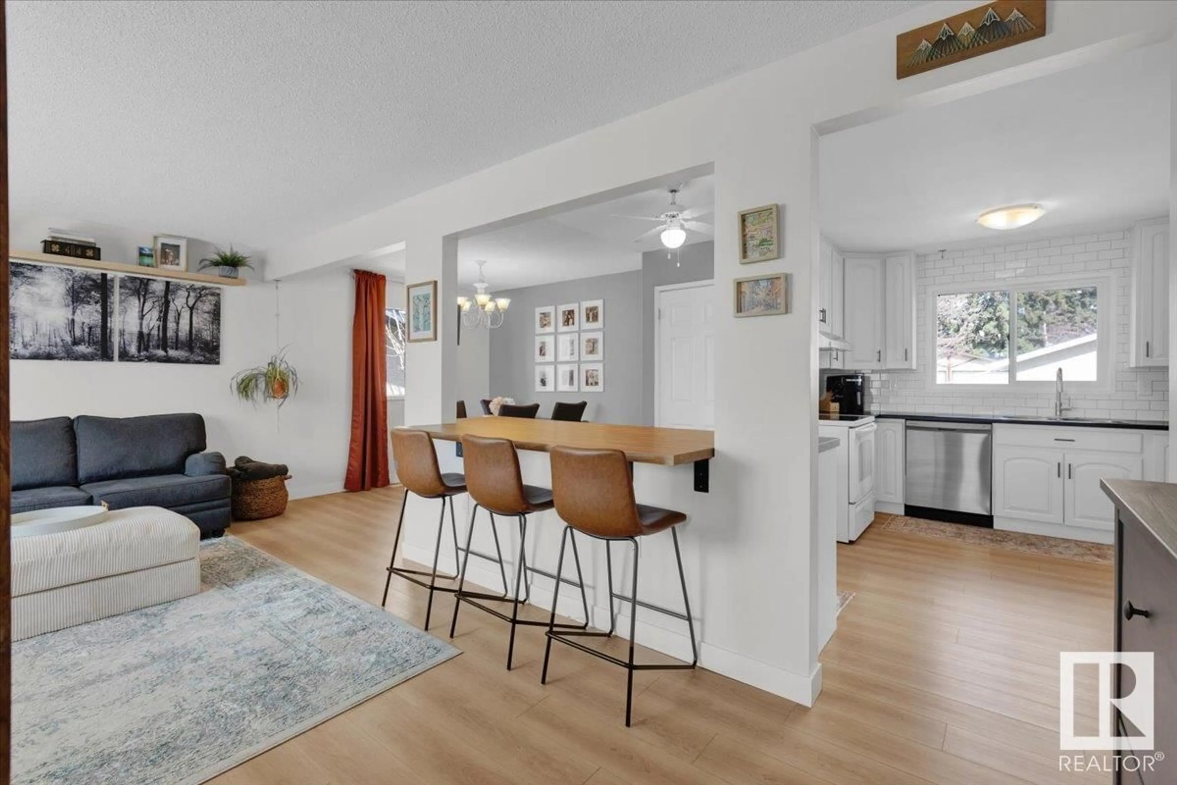 Open concept kitchen, wood/laminate floor for 7212 138 AV, Edmonton Alberta T5C2L8