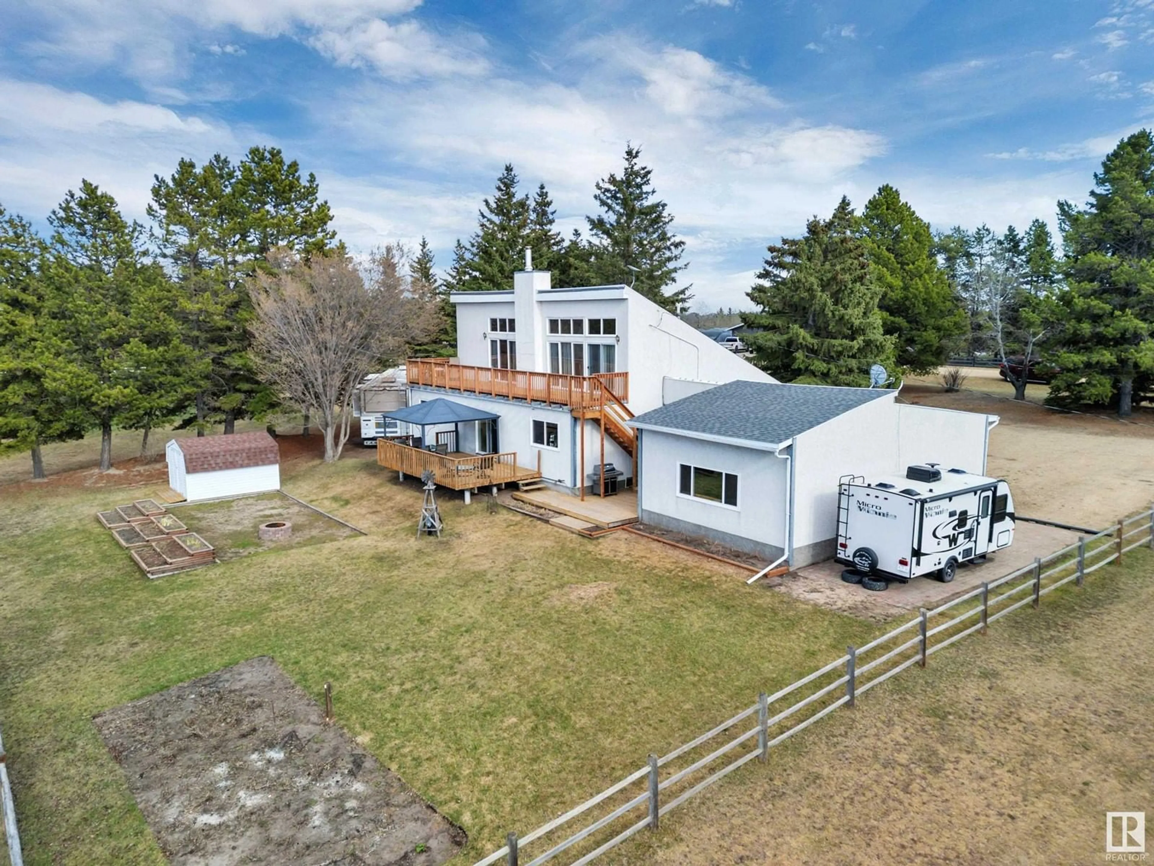 A pic from outside/outdoor area/front of a property/back of a property/a pic from drone, building for 244 - 20 464031 RR, Rural Wetaskiwin County Alberta T9E2E9