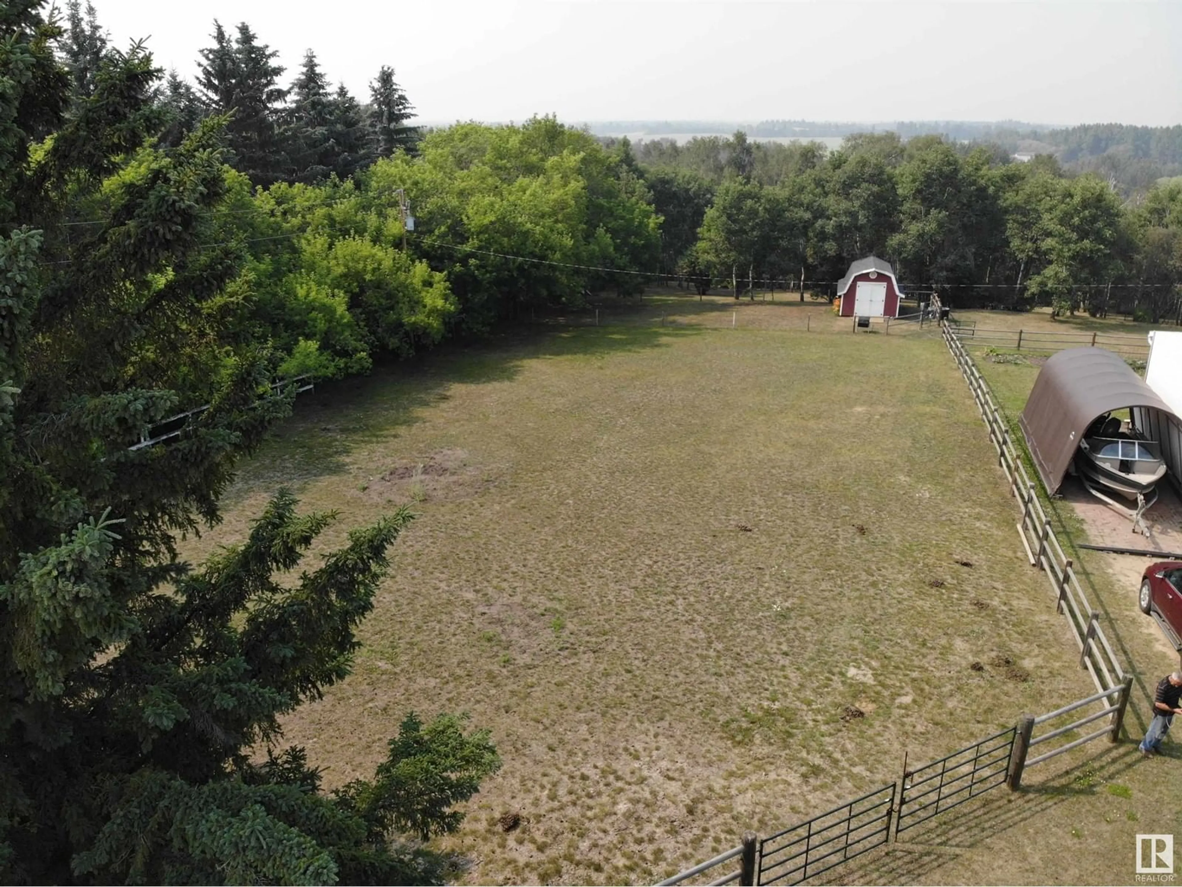 A pic from outside/outdoor area/front of a property/back of a property/a pic from drone, forest/trees view for 244 - 20 464031 RR, Rural Wetaskiwin County Alberta T9E2E9
