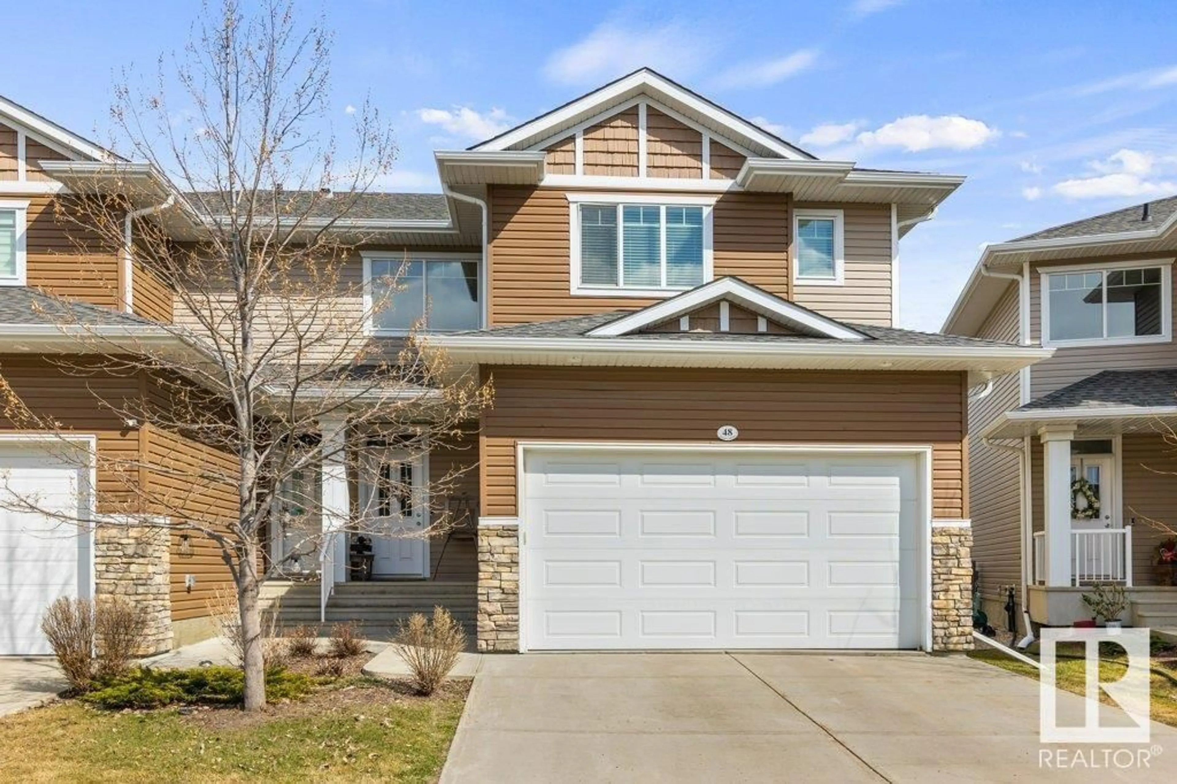 Home with vinyl exterior material, street for 48 18230 104A ST NW, Edmonton Alberta T5X0G9