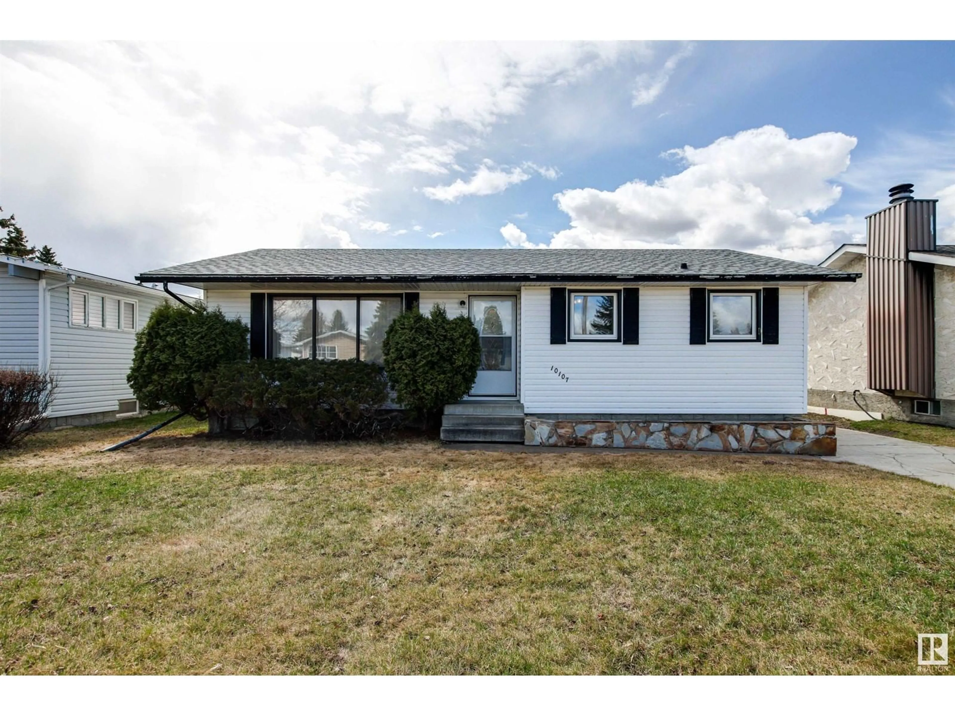 Home with vinyl exterior material, street for 10107 104 AV, Morinville Alberta T8R1A8