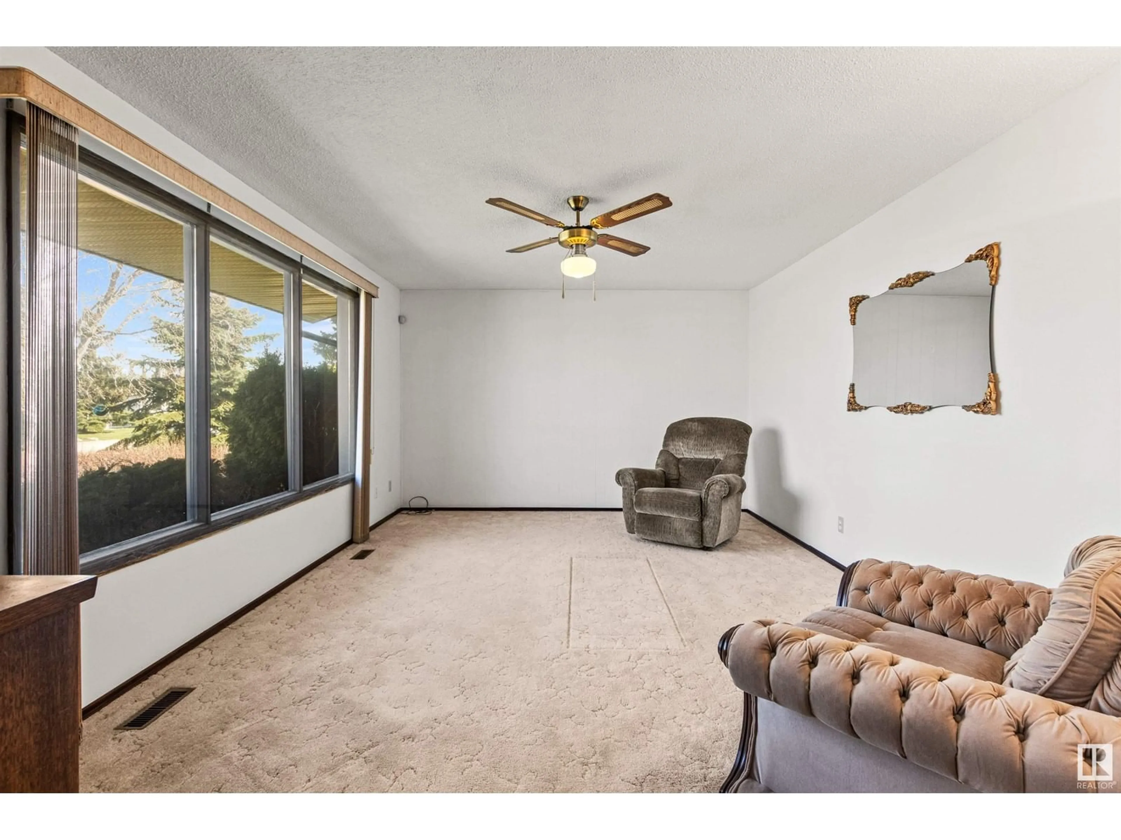 Living room with furniture, unknown for 10107 104 AV, Morinville Alberta T8R1A8
